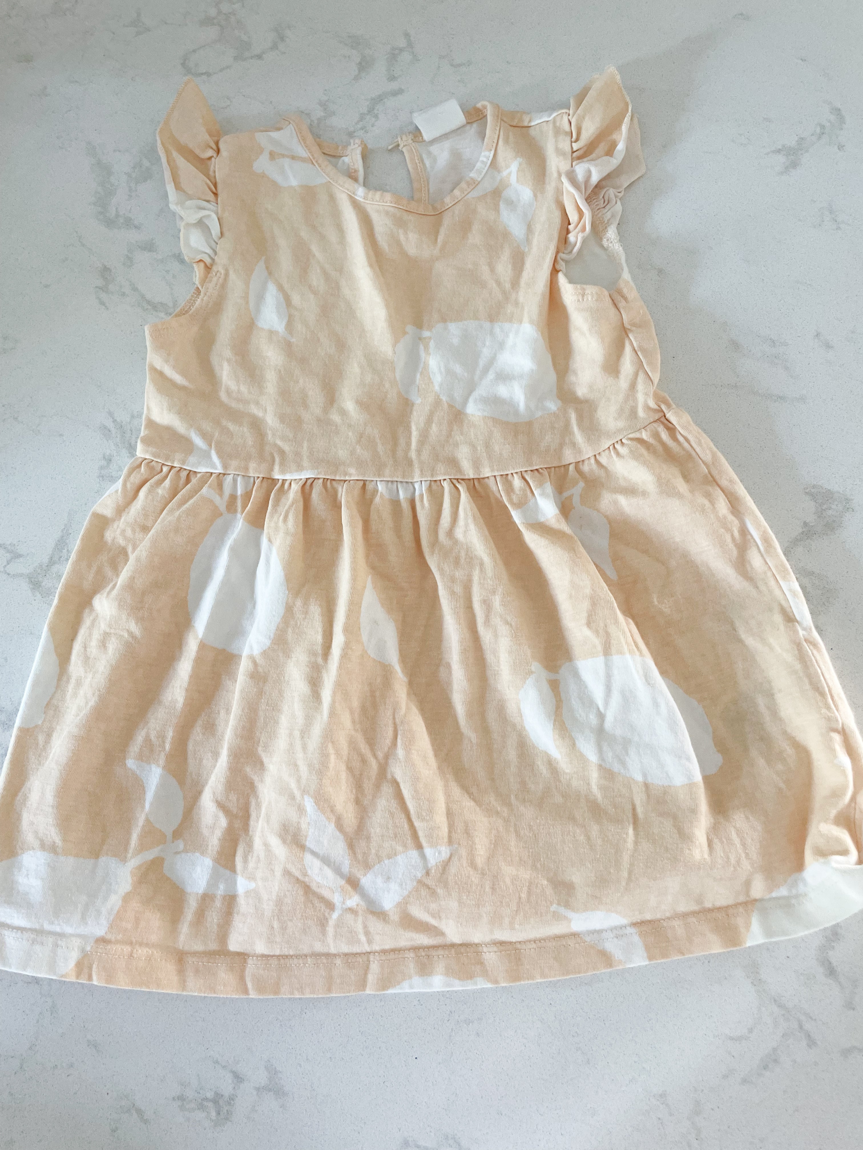H&M-9-12m-VGUC-peach coloured dress with white lemon pattern