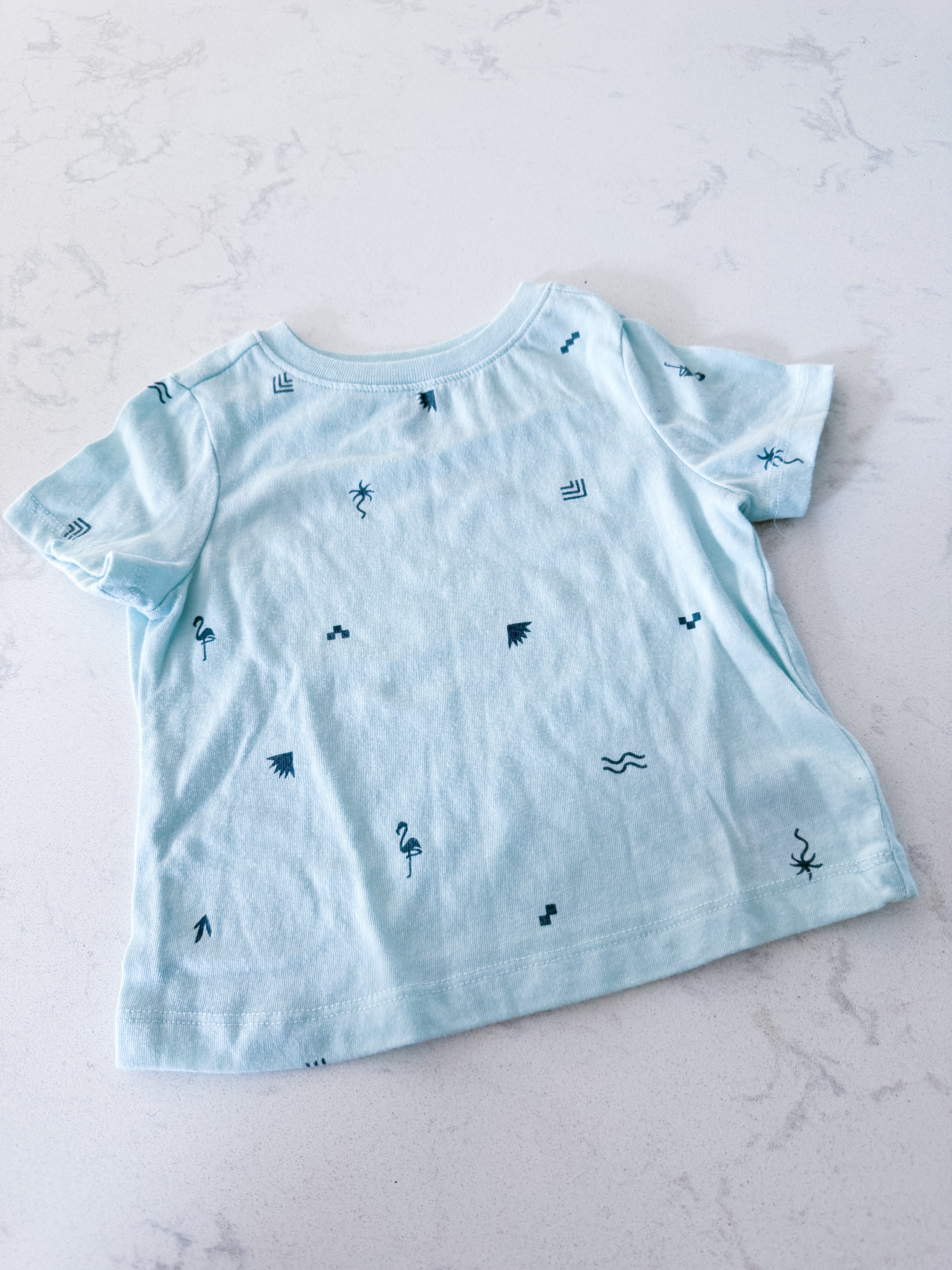 Old Navy- 12-18m- GUC- light bright blue t shirt with tropical minimalist symbols