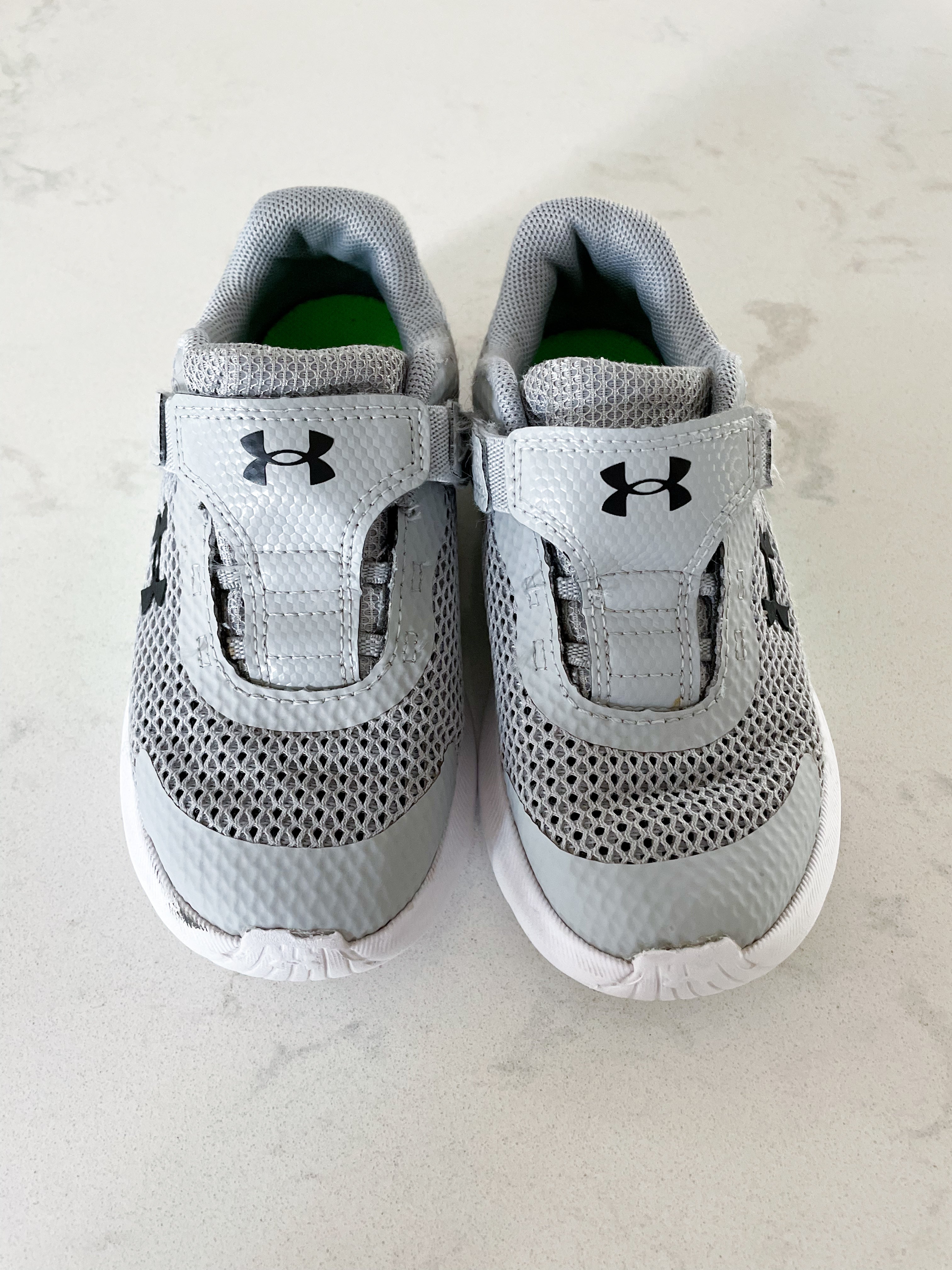 Under Armour- 9C- grey shoes with green and black