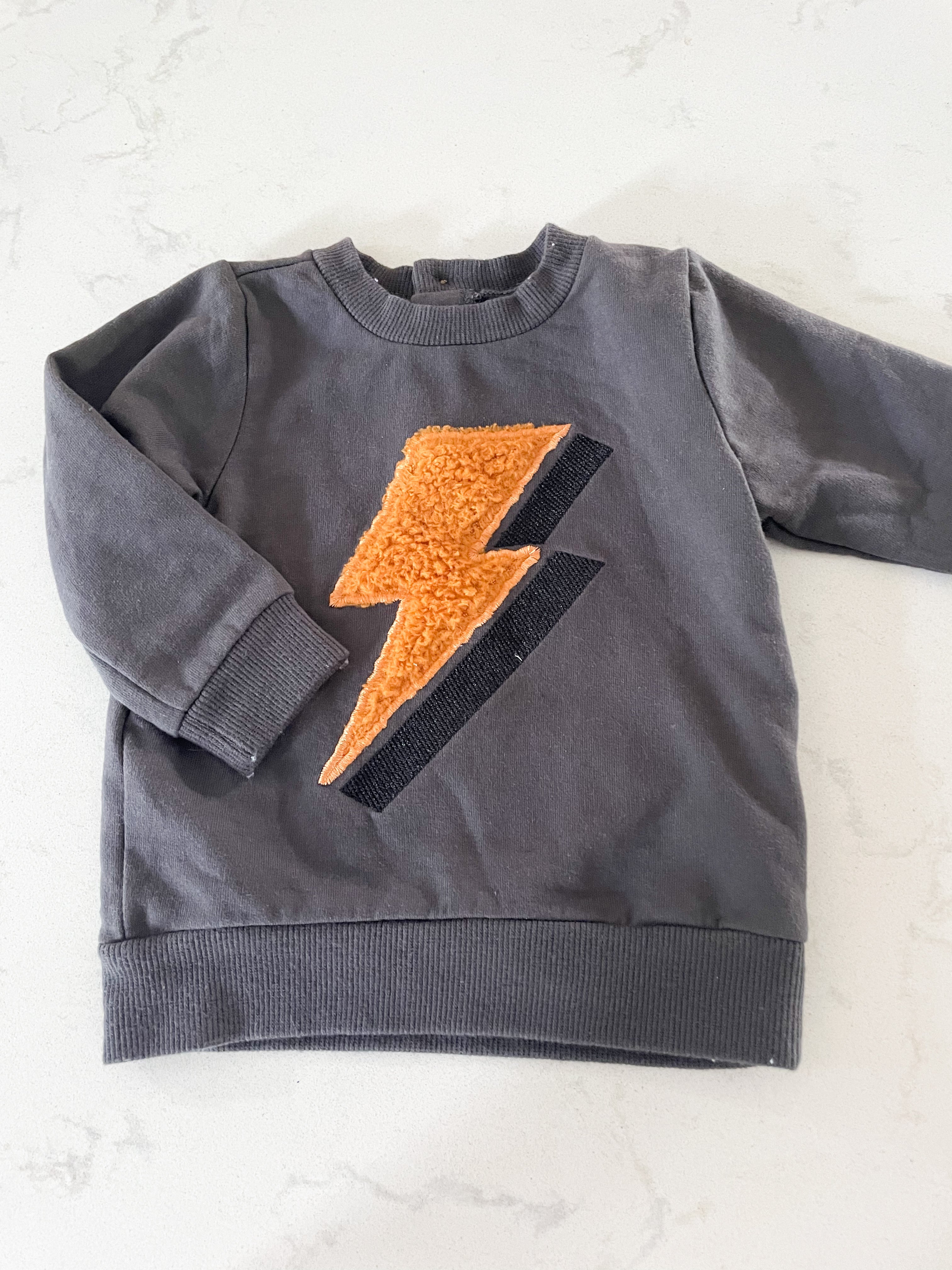 PL Baby-9m-GUC- dark grey crewneck with lightning bolt