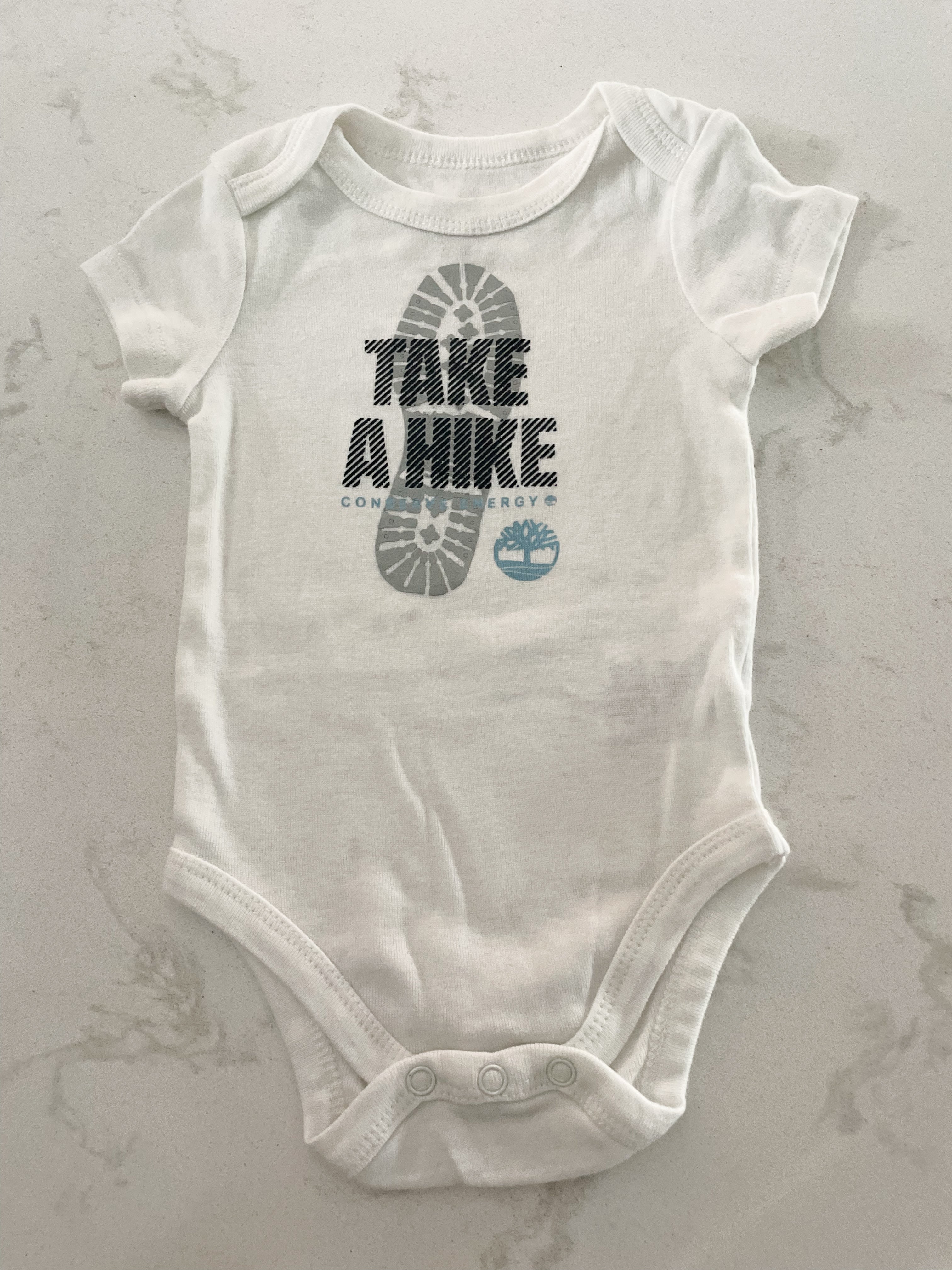 Timberland-6-9m-GUC-white short sleeved bodysuit “Take a hike”