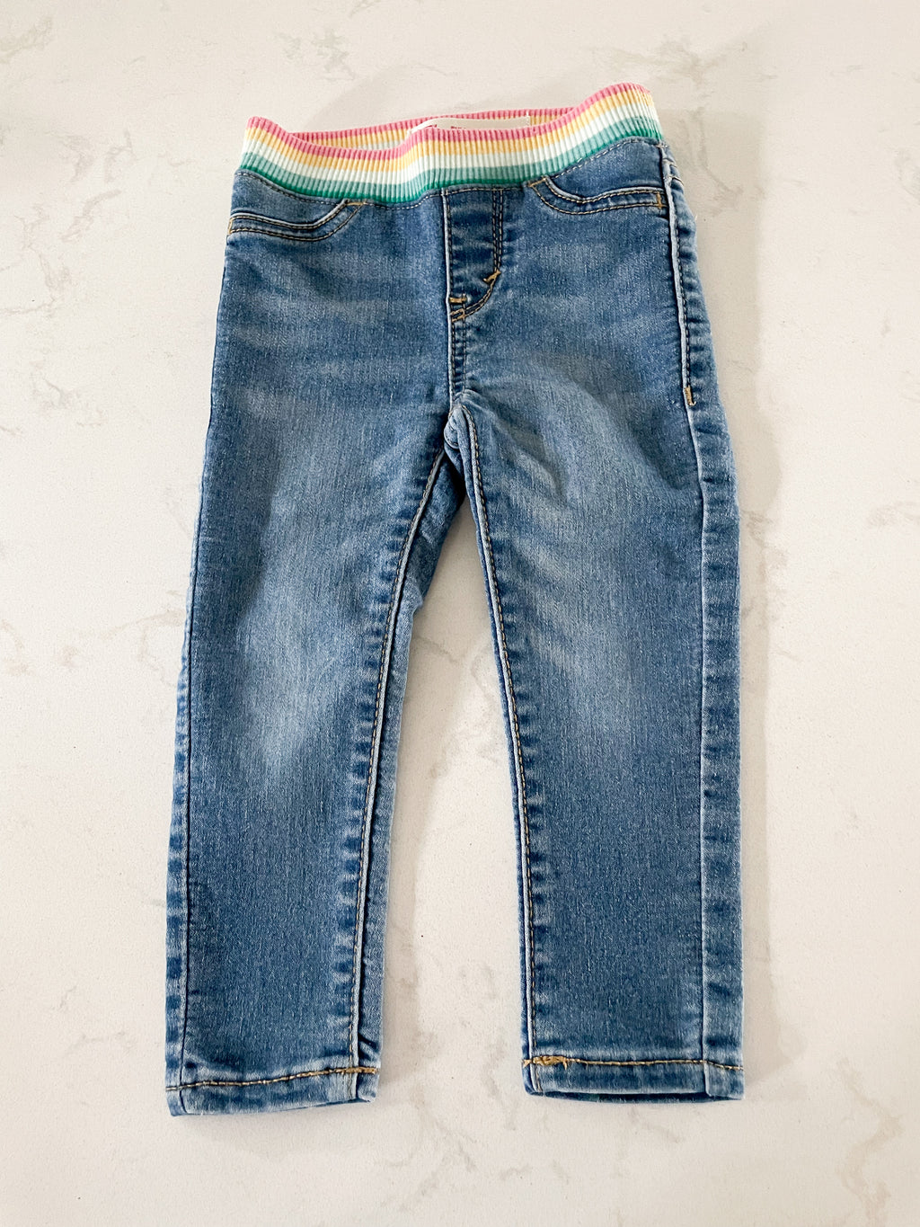 Levi’s- size tag removed (12-18m)- jeans with rainbow sweat band