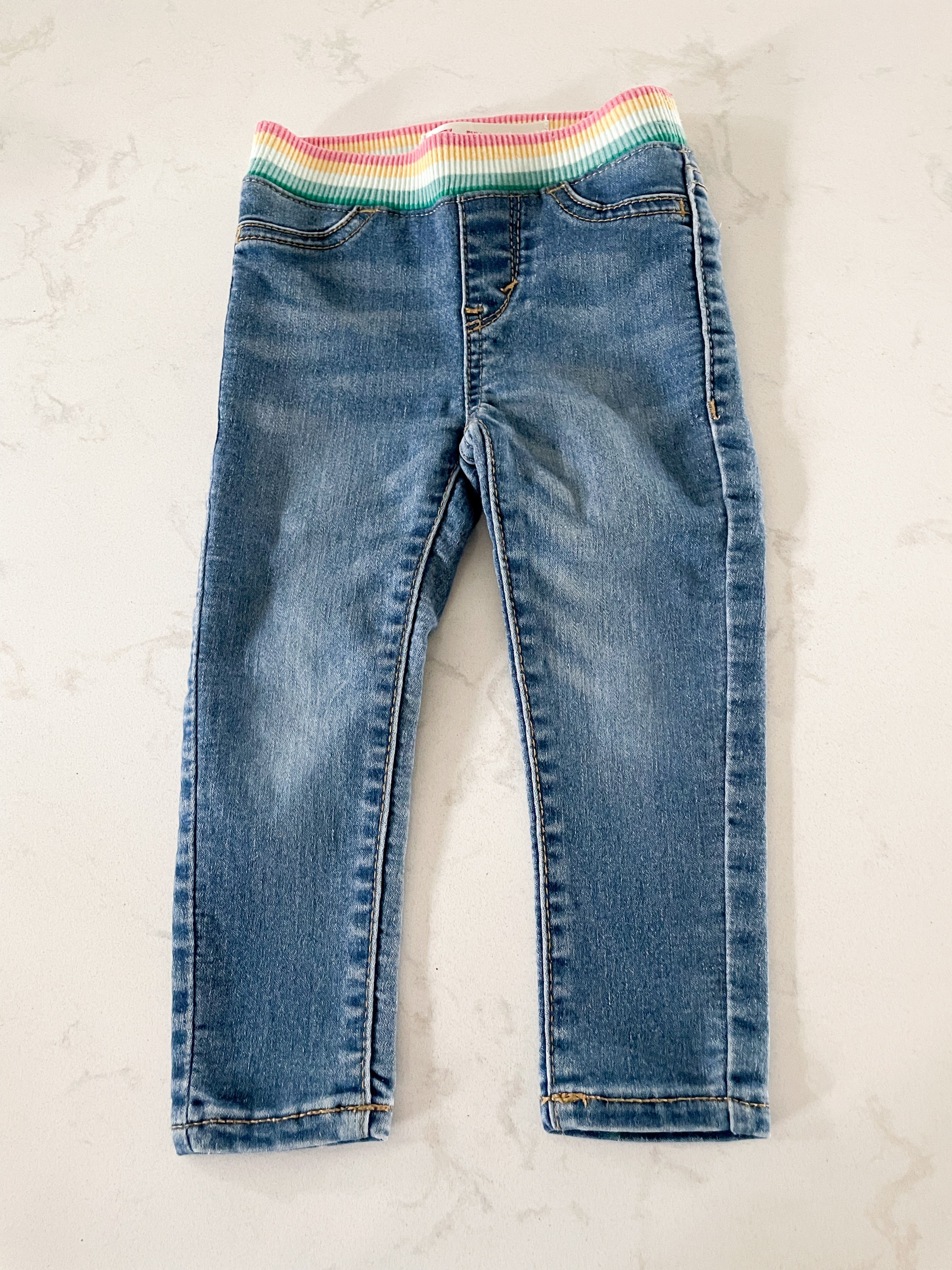 Levi’s- size tag removed (12-18m)- jeans with rainbow sweat band