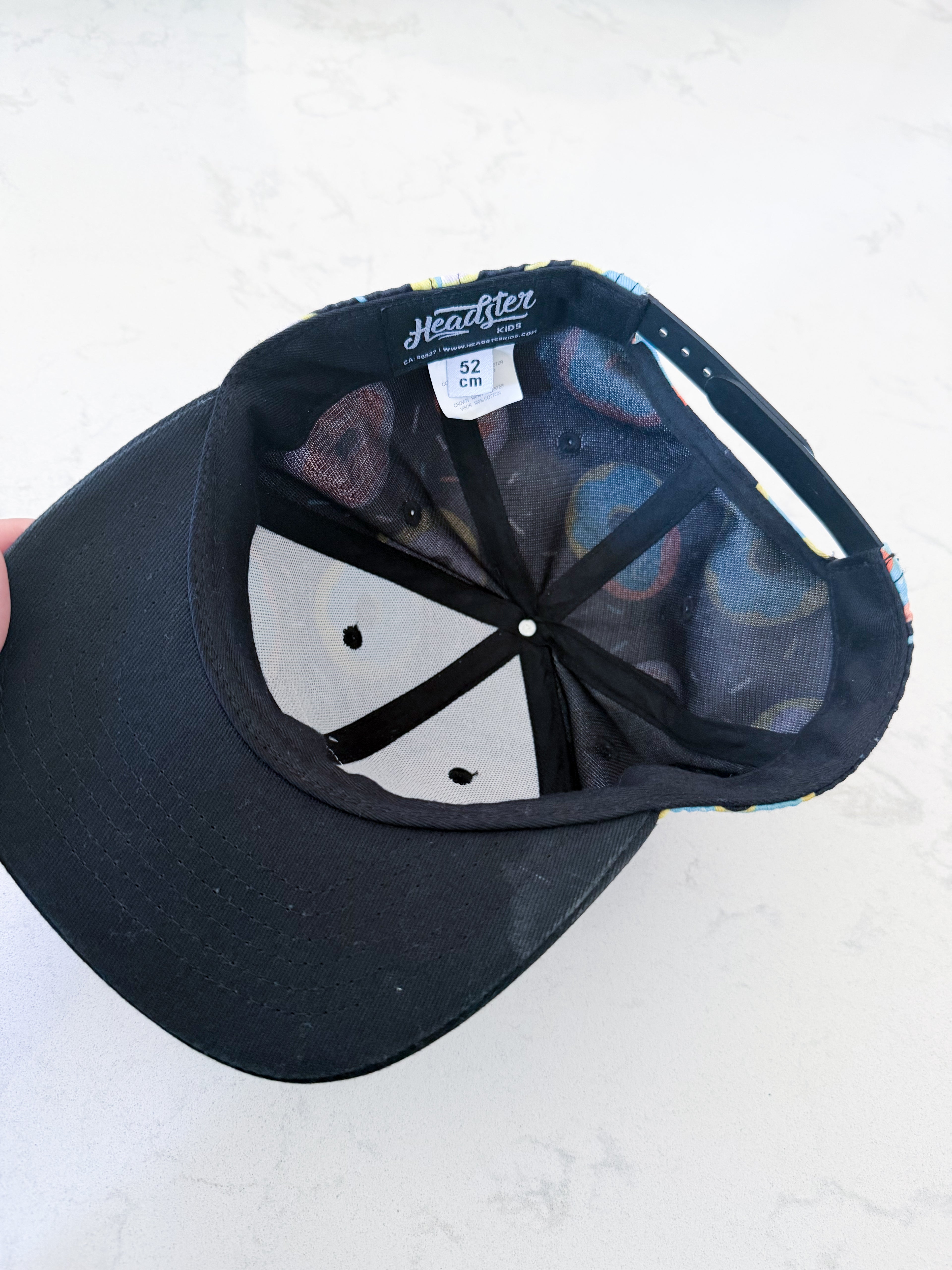 Headster- 52cm- GUC- black cap with colourful donuts