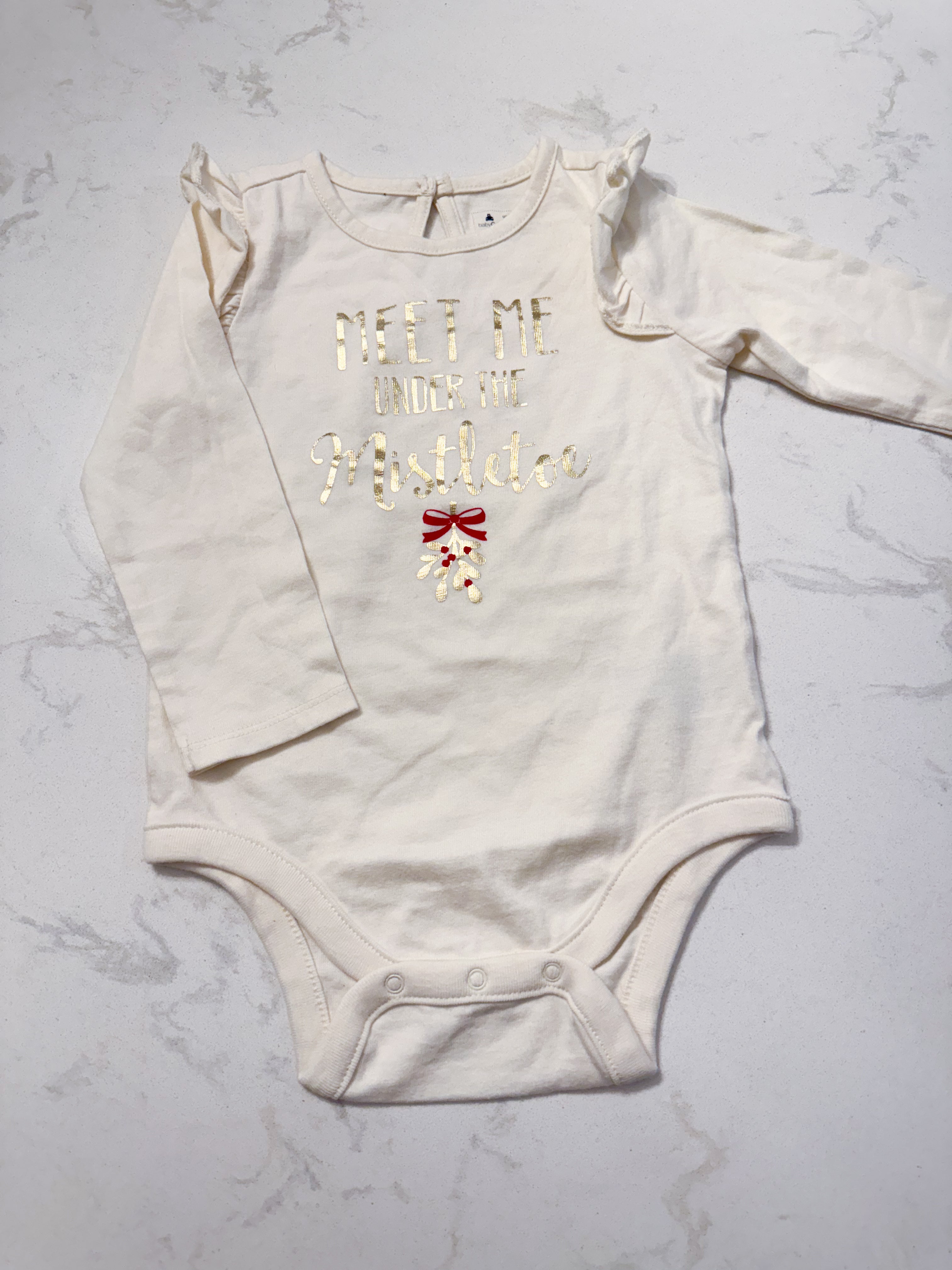 Gap- 18-24m- VGUC- cream coloured ruffle bodysuit with gold lettering “meet me under the mistletoe”