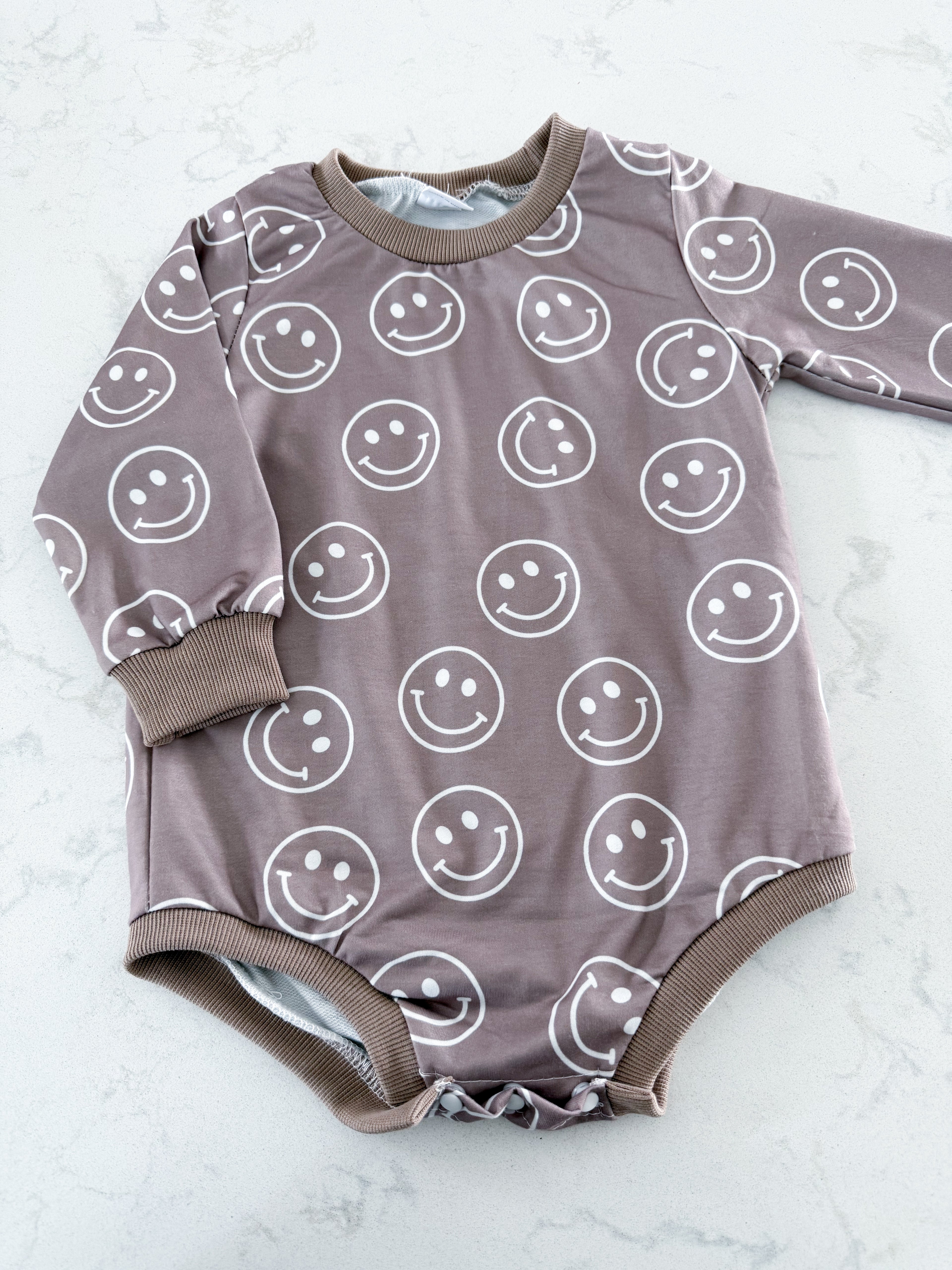 No brand- fits 2T+- EUC- brown smiley bodysuit