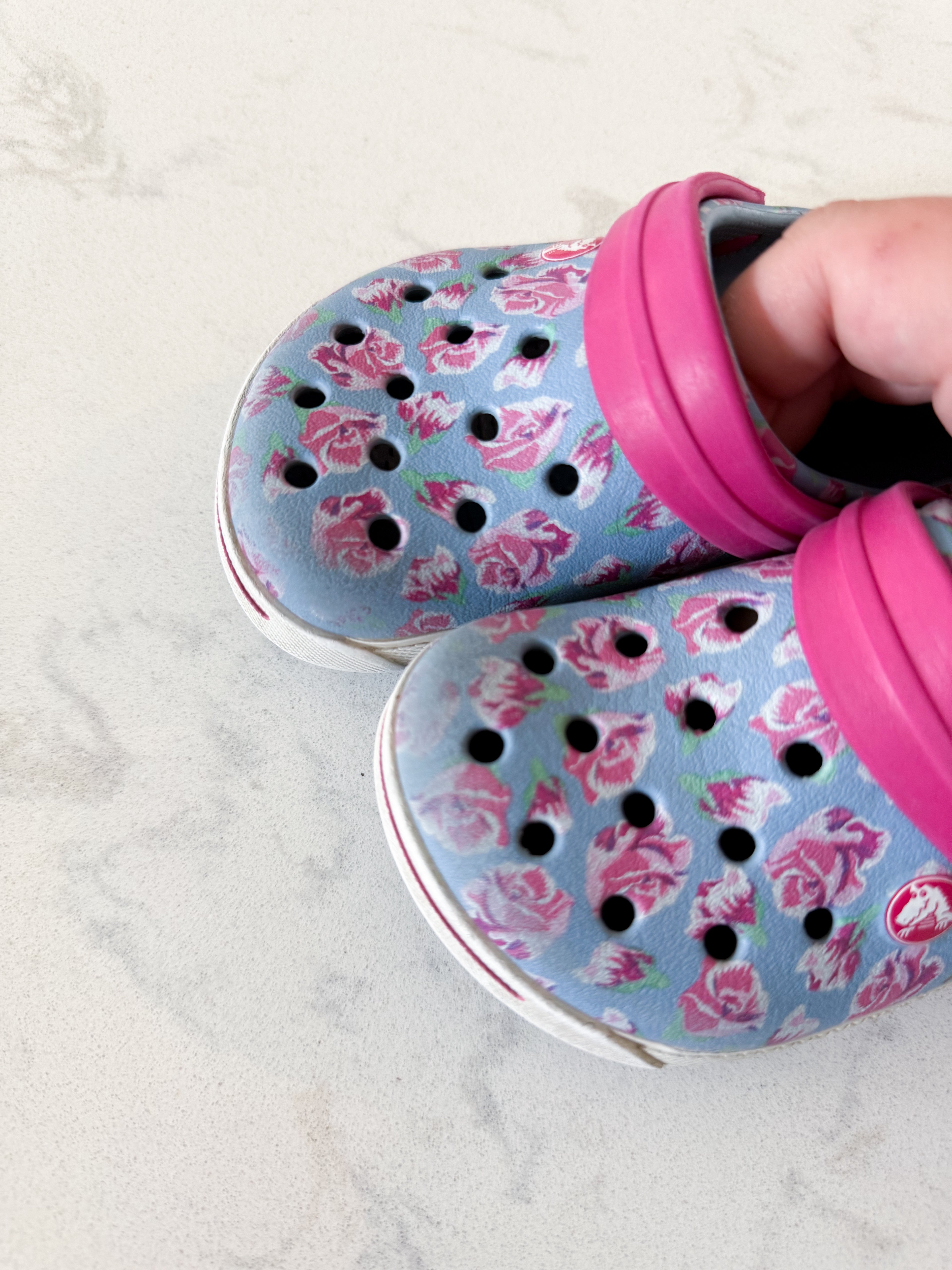 Crocs- 6/7C- GUC- light blue with pink florals slip on crocs