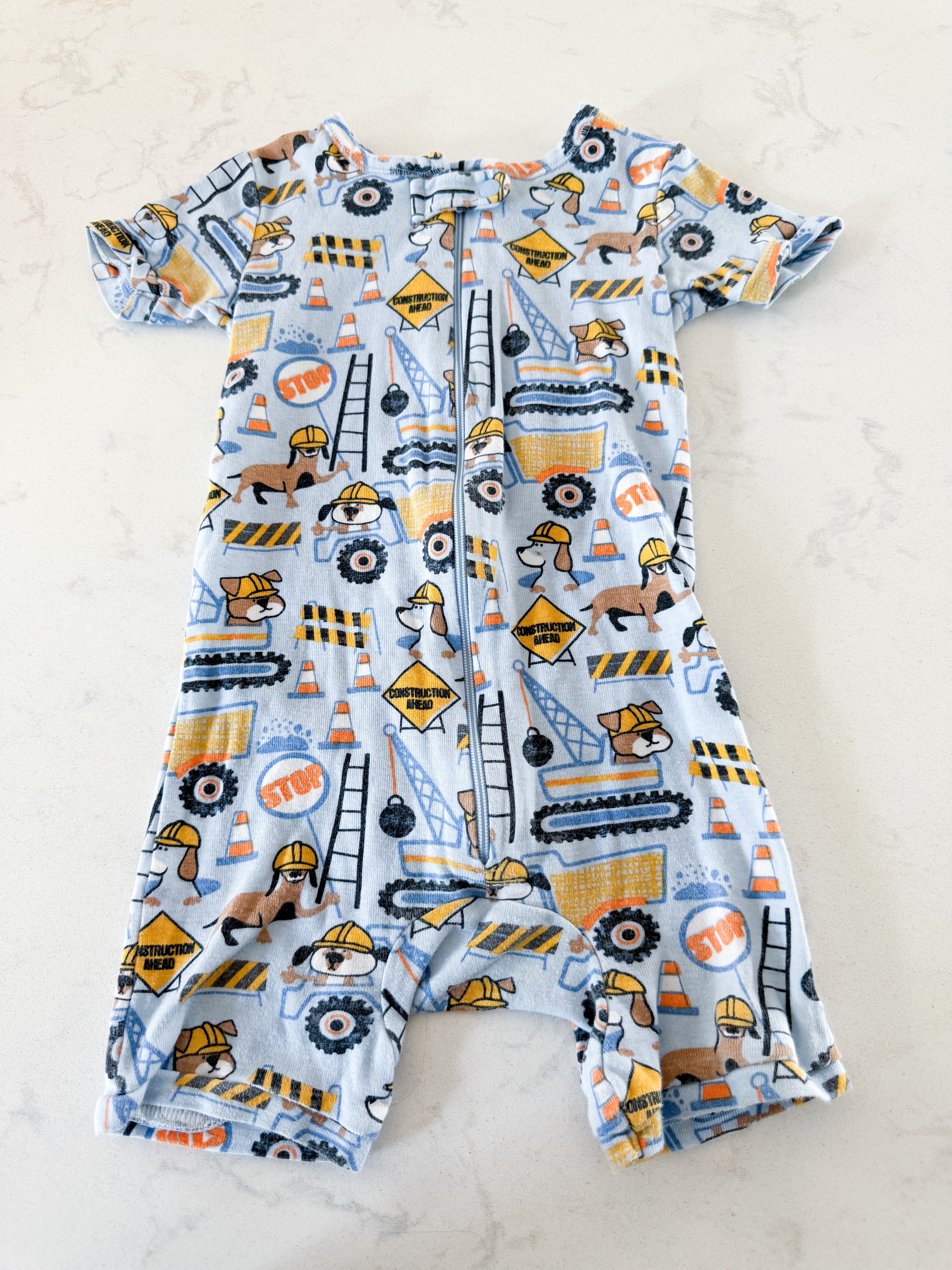 The Children’s Place- fits 12-18m- GUC- light blue shortie jammies with construction pups