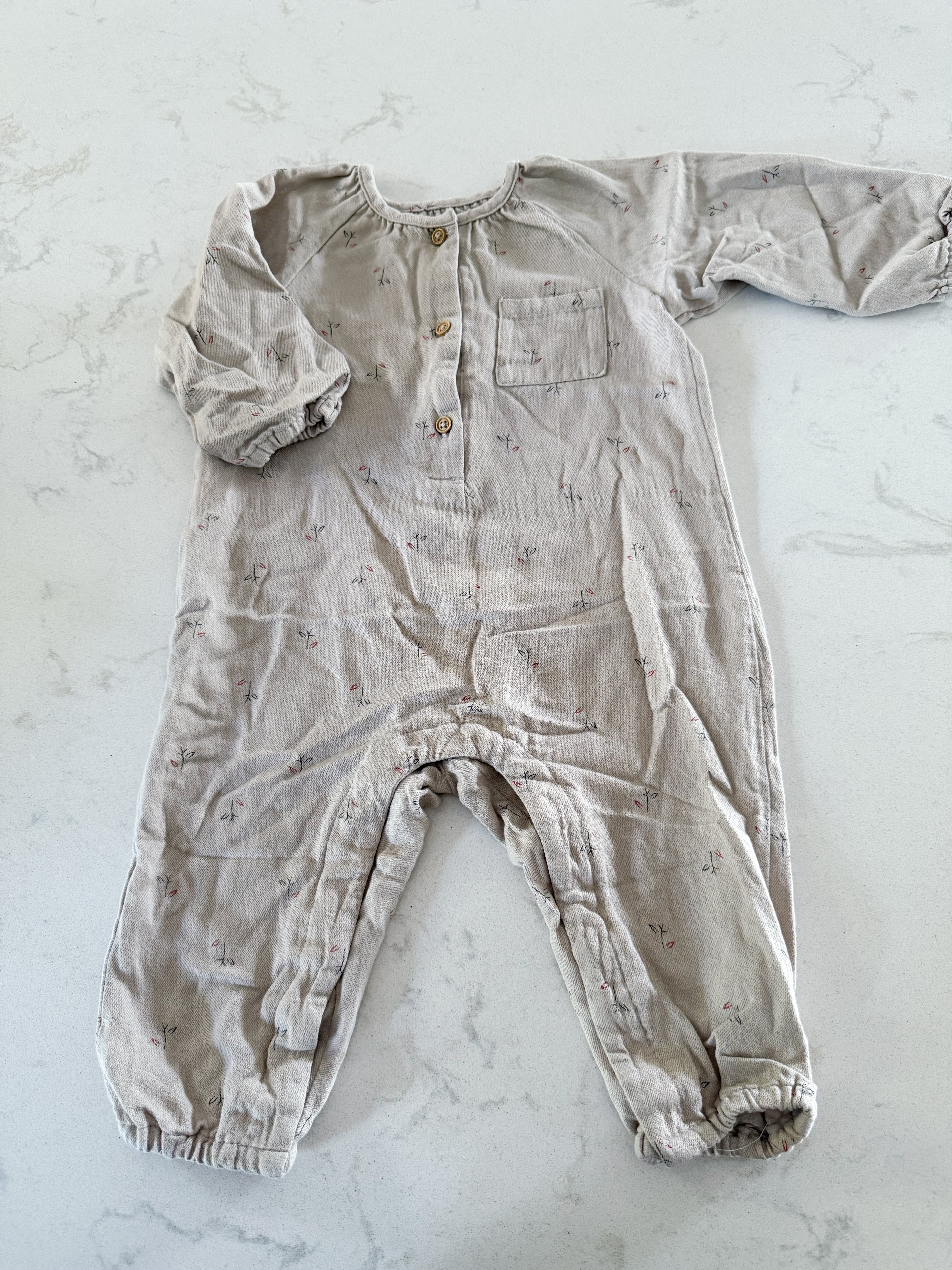 Zara-9-12m- GUC- beige/grey one piece with minimalist floral pattern