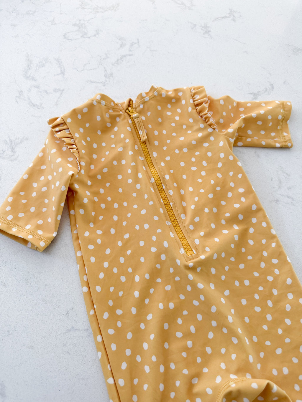 H&M- 9-12m- VGUC- mustard yellow swimsuit with white polka dots and ruffles