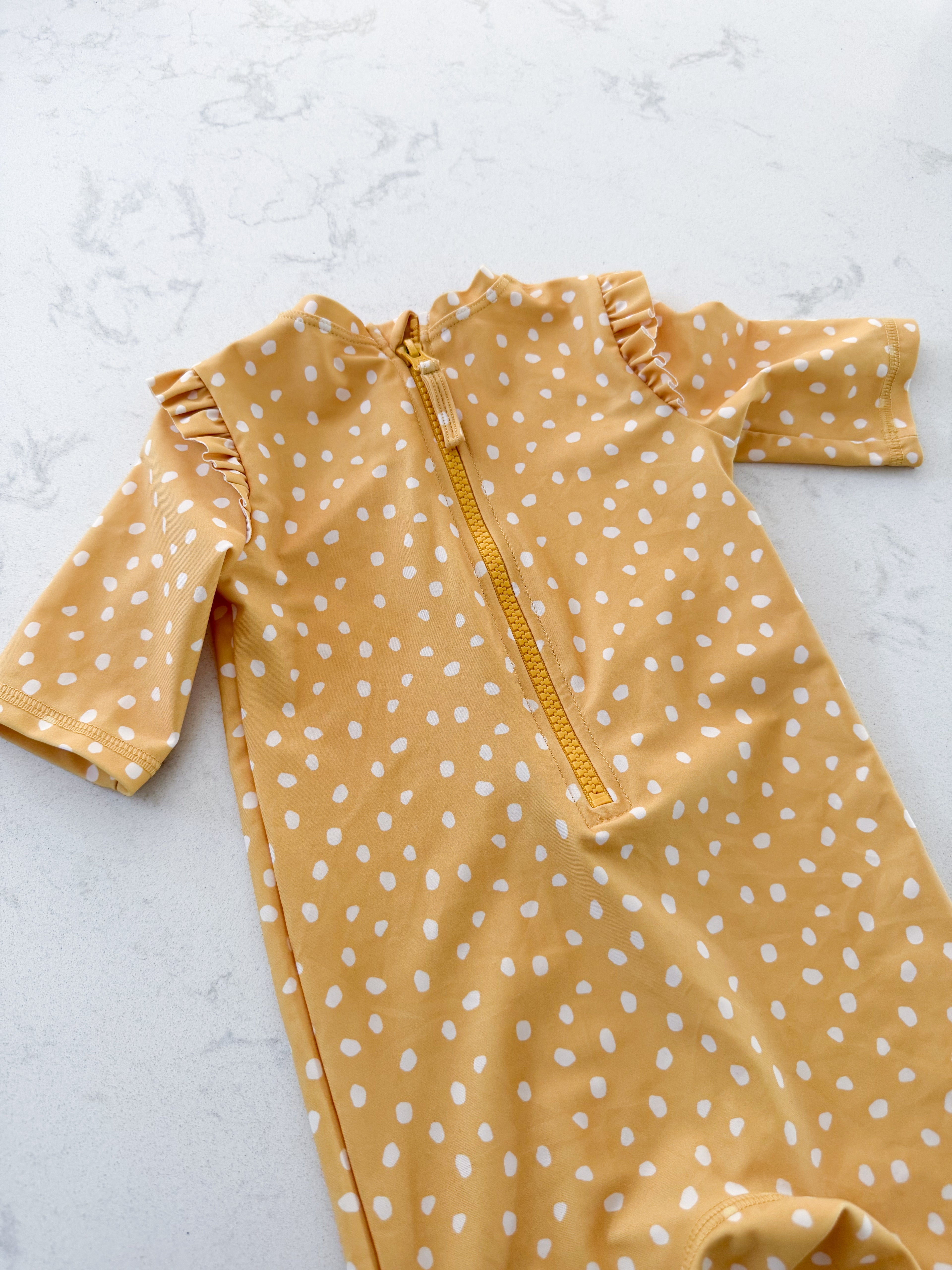 H&M- 9-12m- VGUC- mustard yellow swimsuit with white polka dots and ruffles
