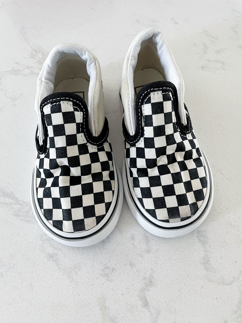 Vans- 6C- slip on black and white checkered shoes