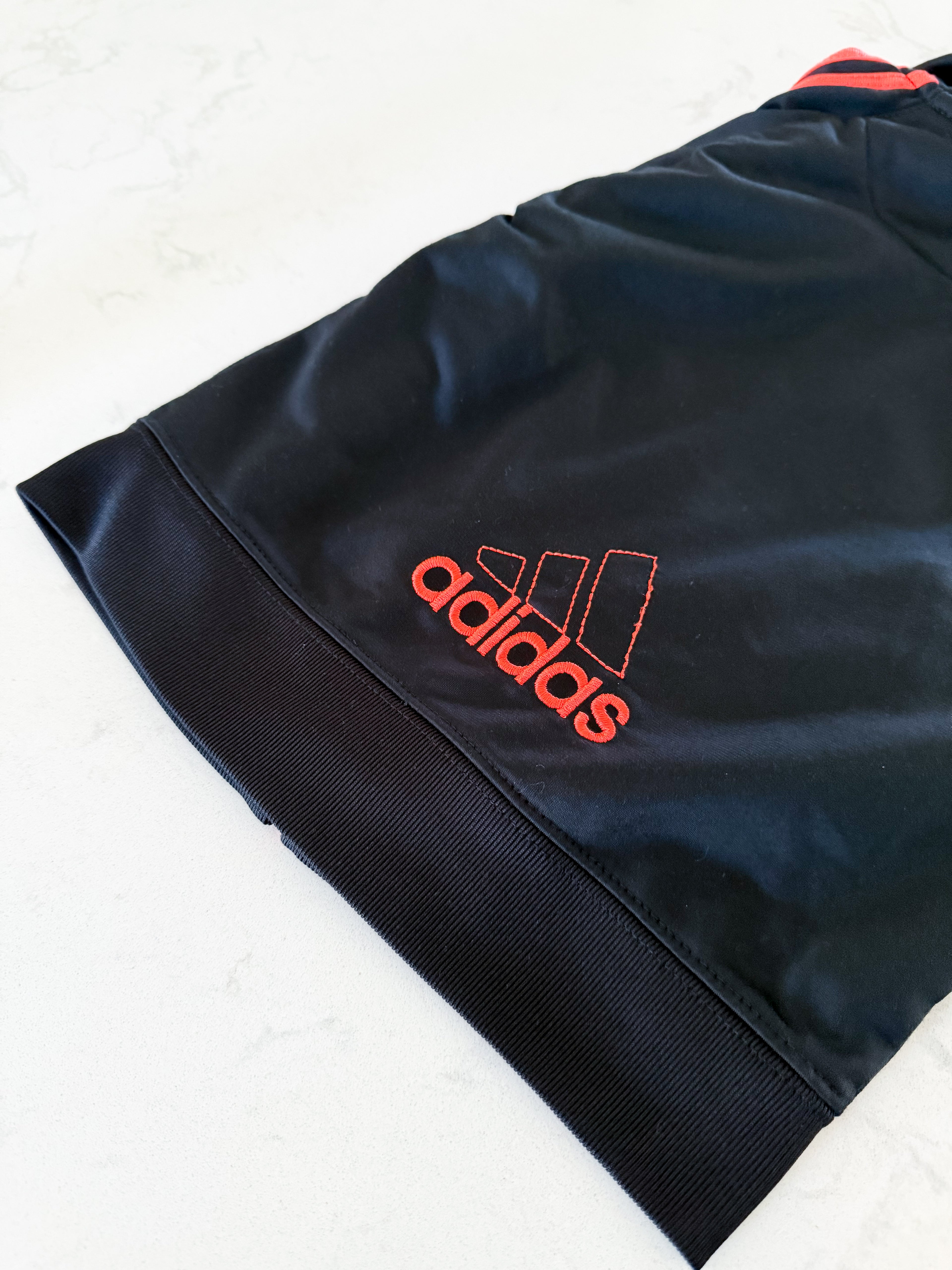 Adidas- 18m- VGUC- black zip up with embroidered orange adidas logo