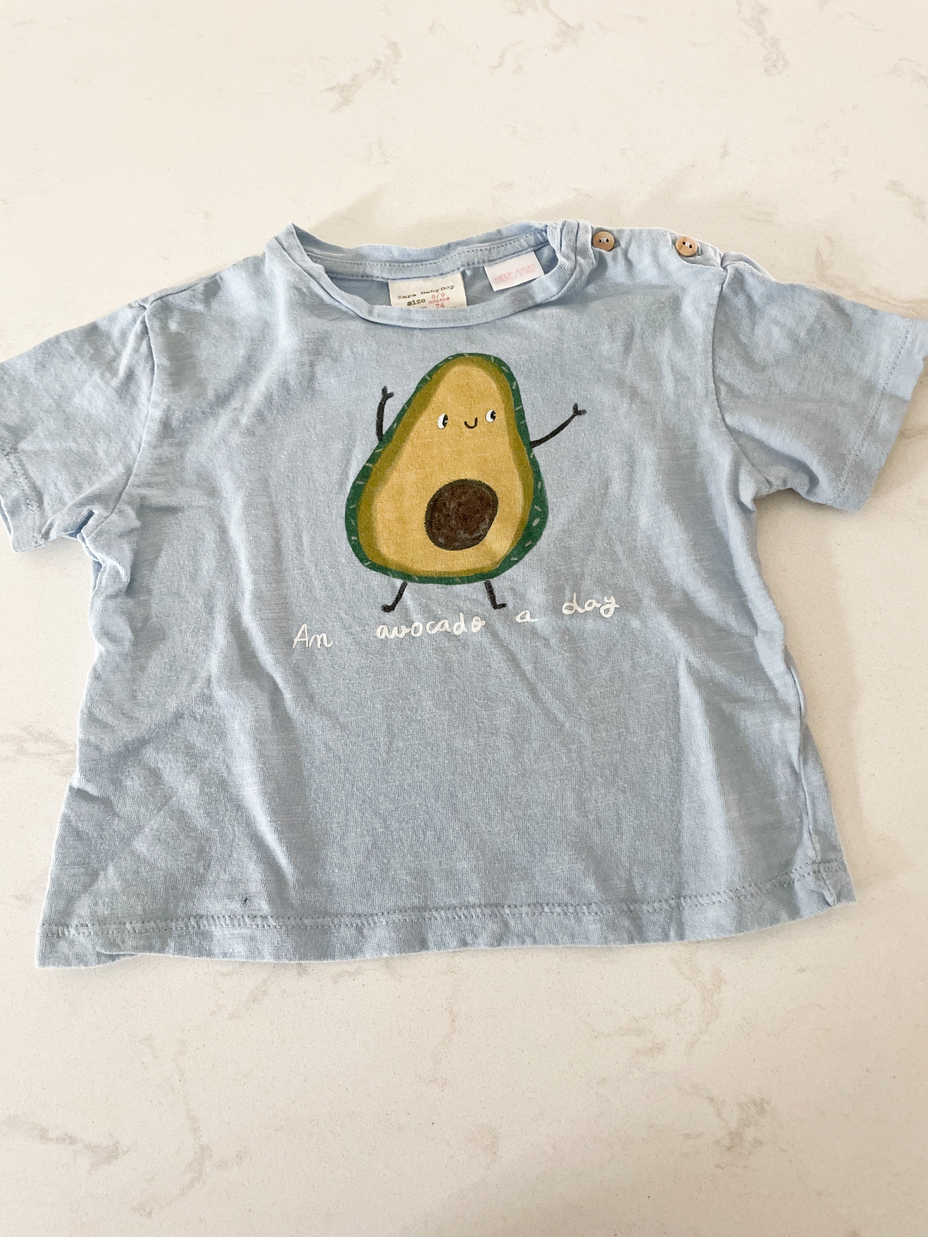Zara-6-9m-GUC- light blue tee with avocado “an avocado a day”