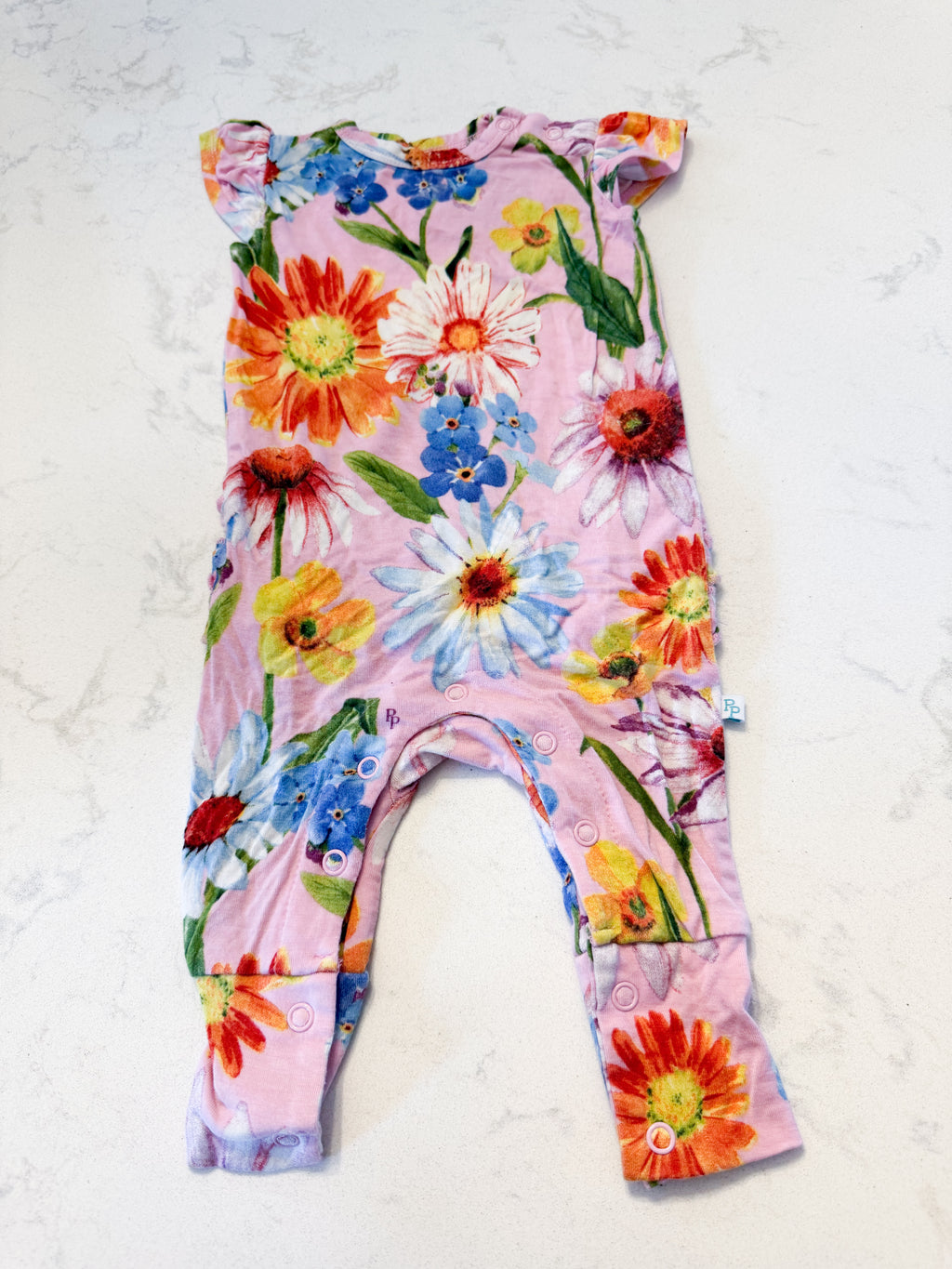 Posh Peanut- 0-3m- VGUC- light pink short sleeve romper with bright florals and ruffle bum