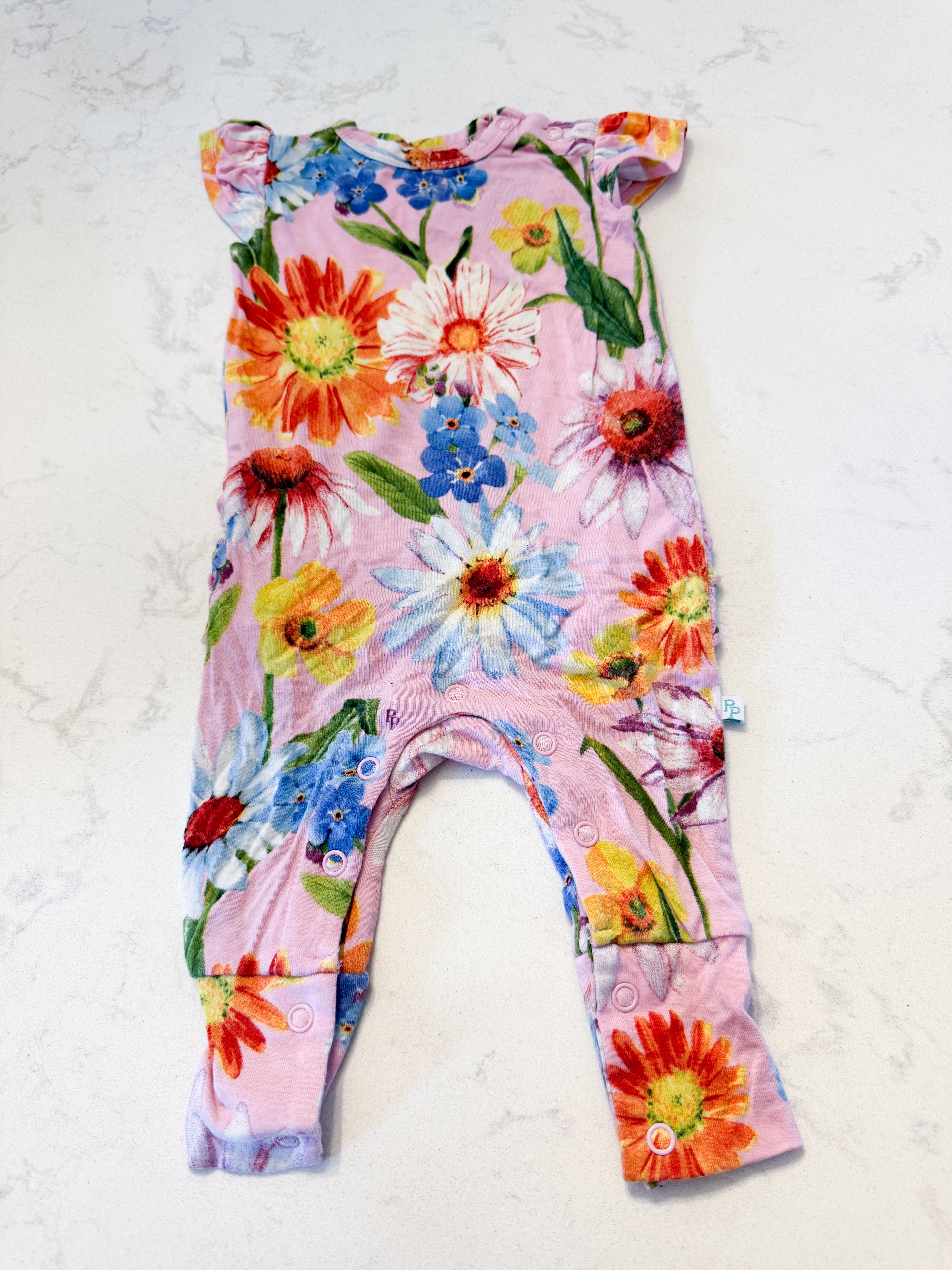Posh Peanut- 0-3m- VGUC- light pink short sleeve romper with bright florals and ruffle bum