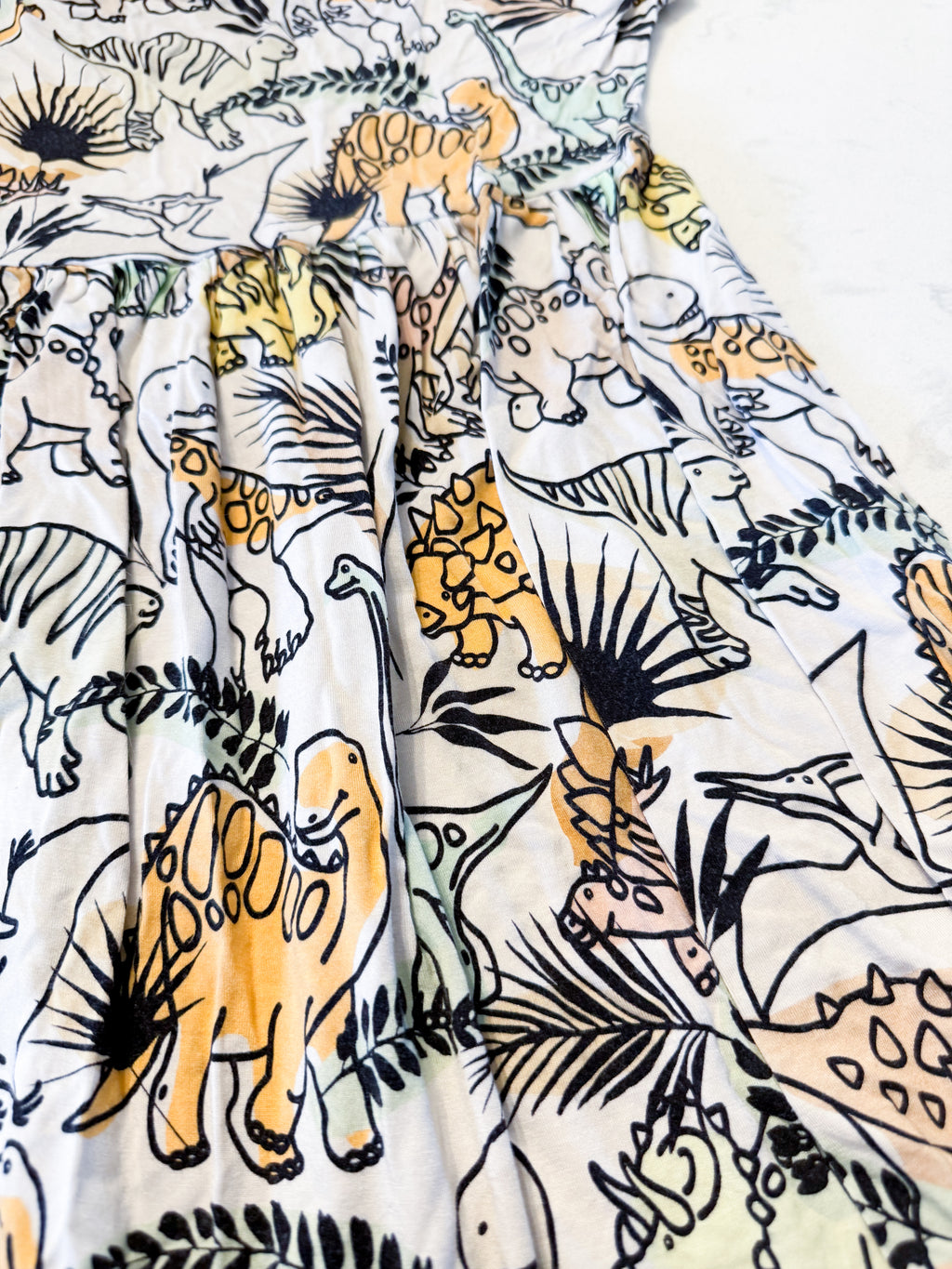 Vi and Jax- 4-5Y- VGUC- beige short sleeved bamboo dress with dinosaur pattern