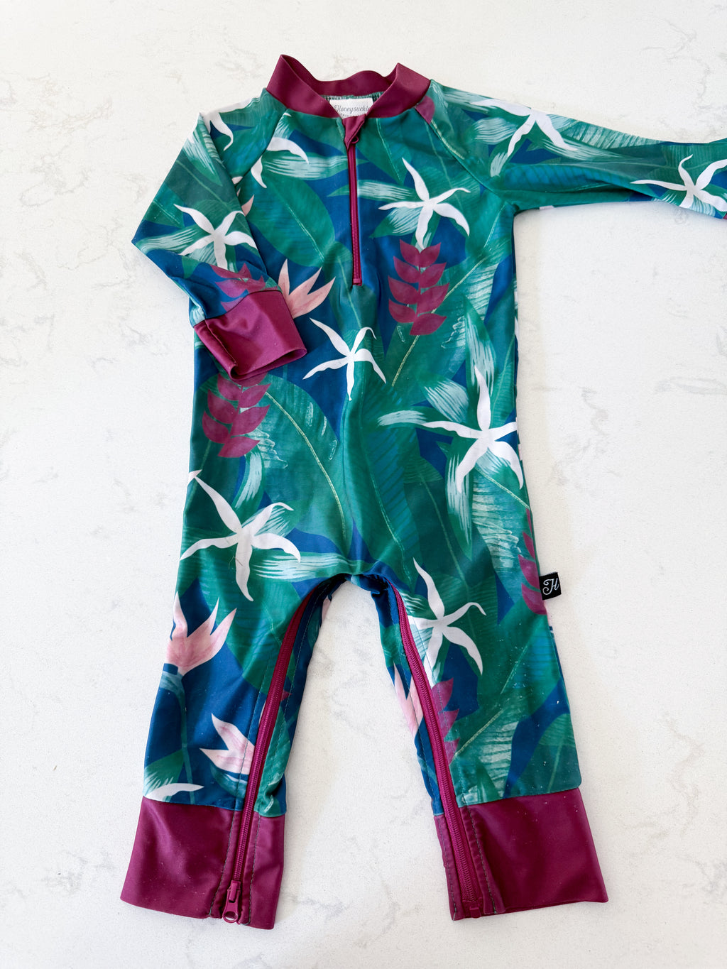 Honeysuckle Swim Company- 12-18m- PLAY- dark purple and green full coverage swim suit with tropical leaves