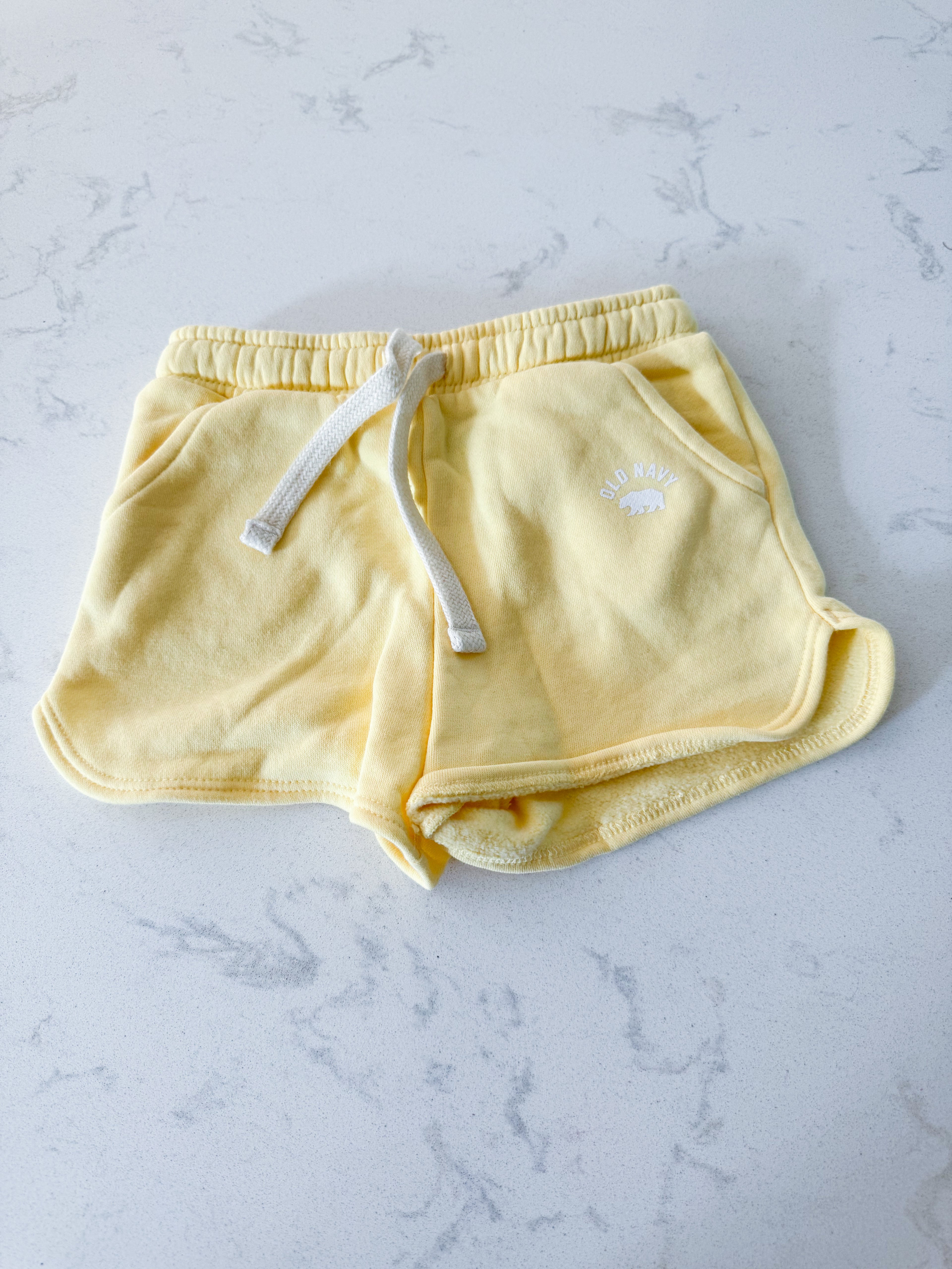 Old Navy- 4T- VGUC- yellow sweat shorts with white symbol