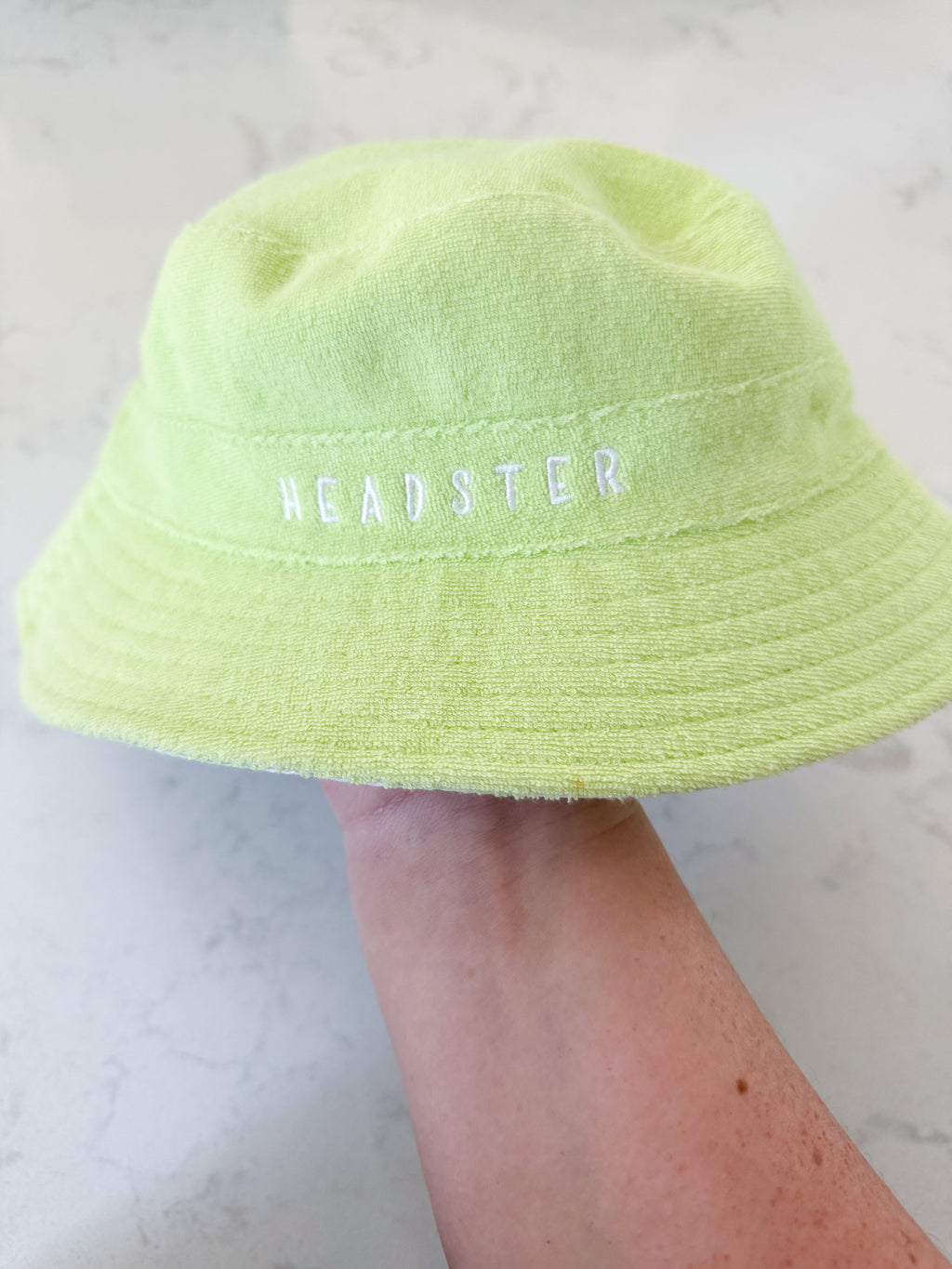 Headster- 52cm- BNWT- green checkered and Terry towel reversible hat