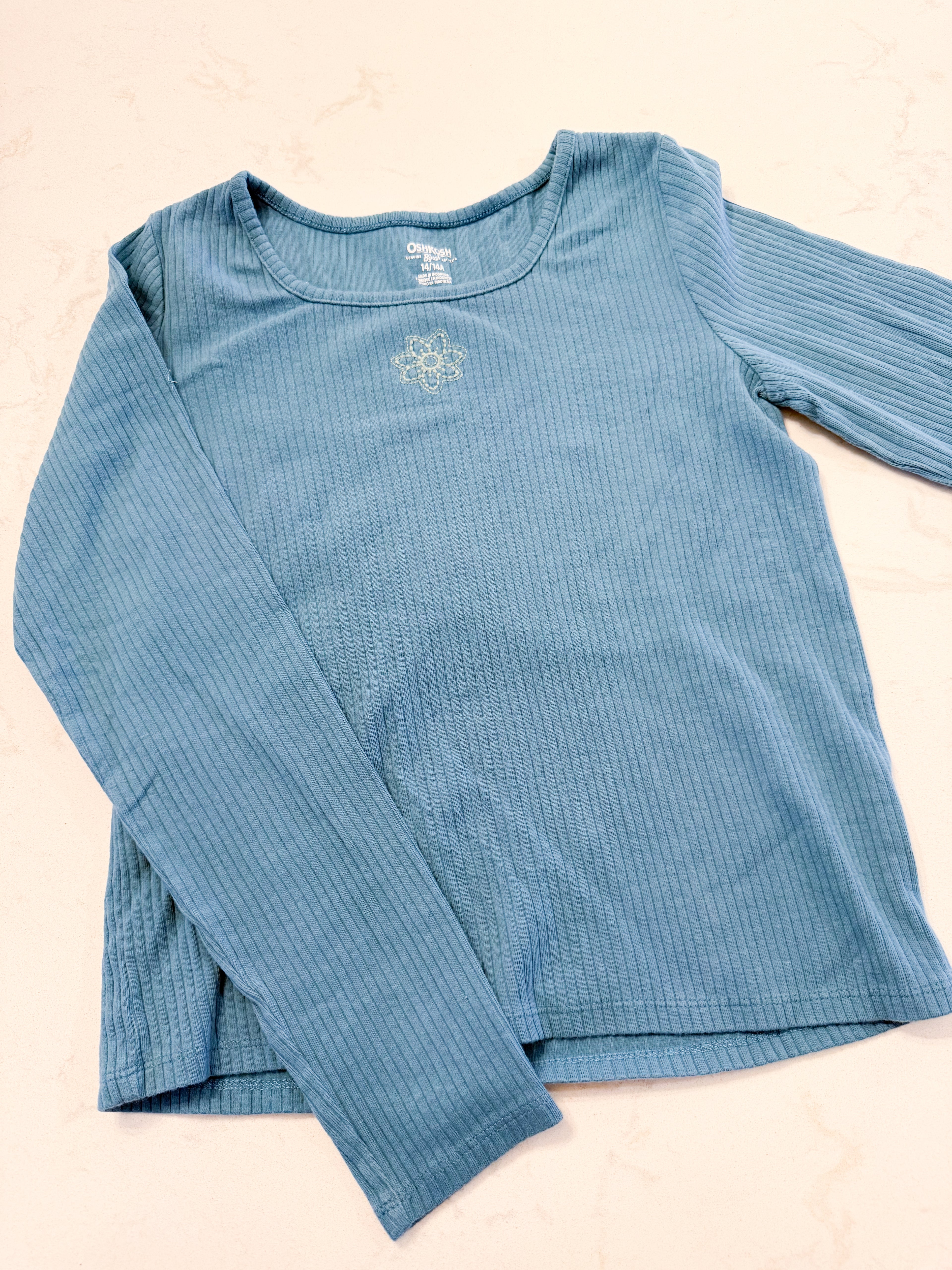Oshkosh- 14Y- GUC- blue ribbed long sleeve shirt with embroidered flower in middle