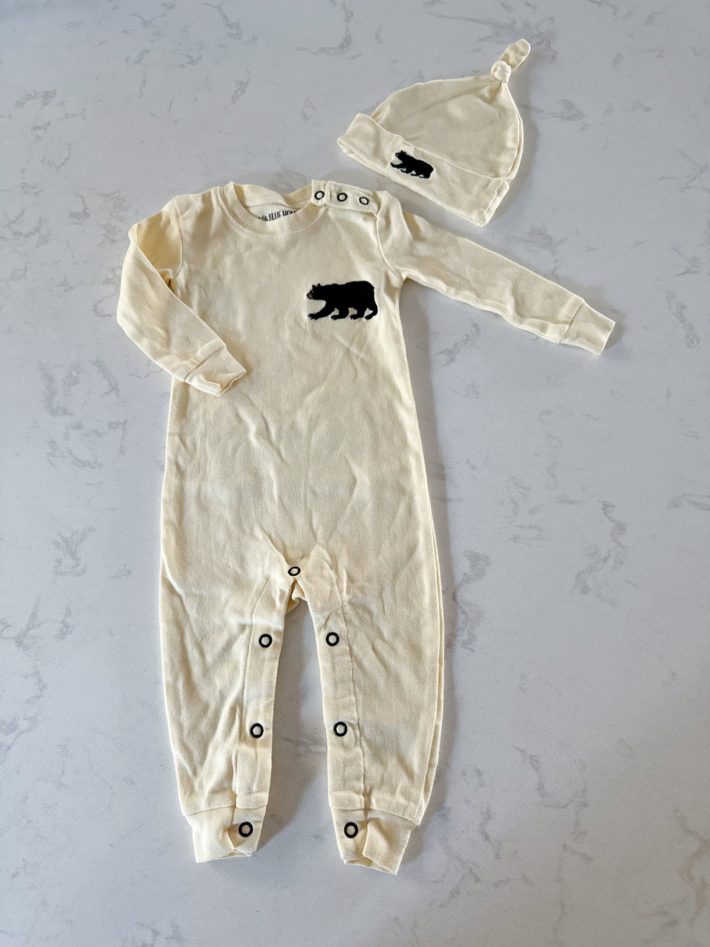 Little Blue House- 6-12m- GUC- creamy yellow footless pajamas with black bear embroidery