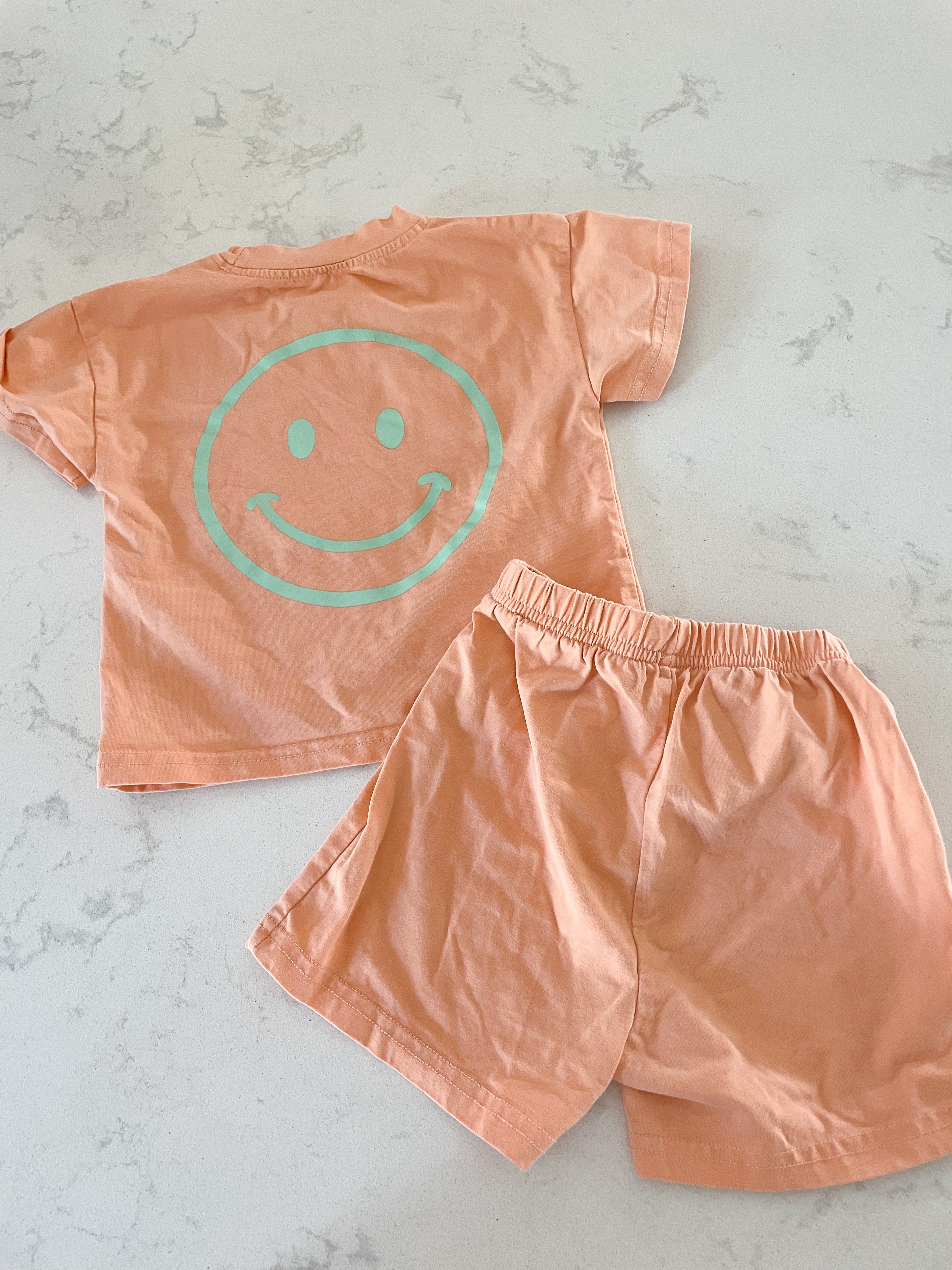 No brand- 12-18m-PLAY- light orange two piece set with happy face
