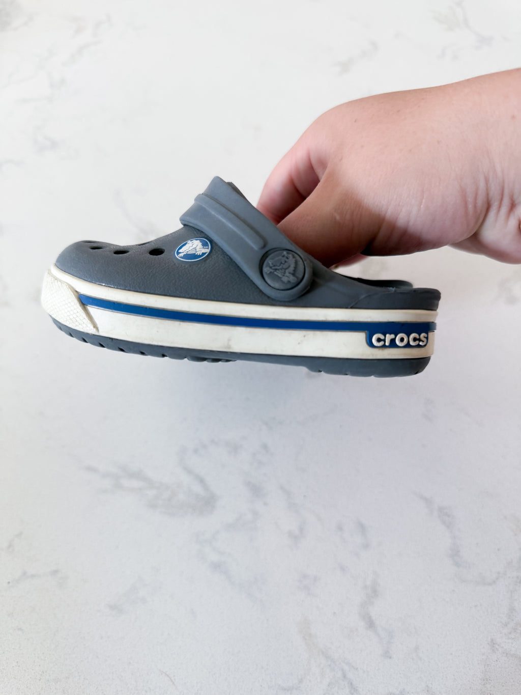 Crocs- 4/5C- GUC- grey slip on crocs with white trim