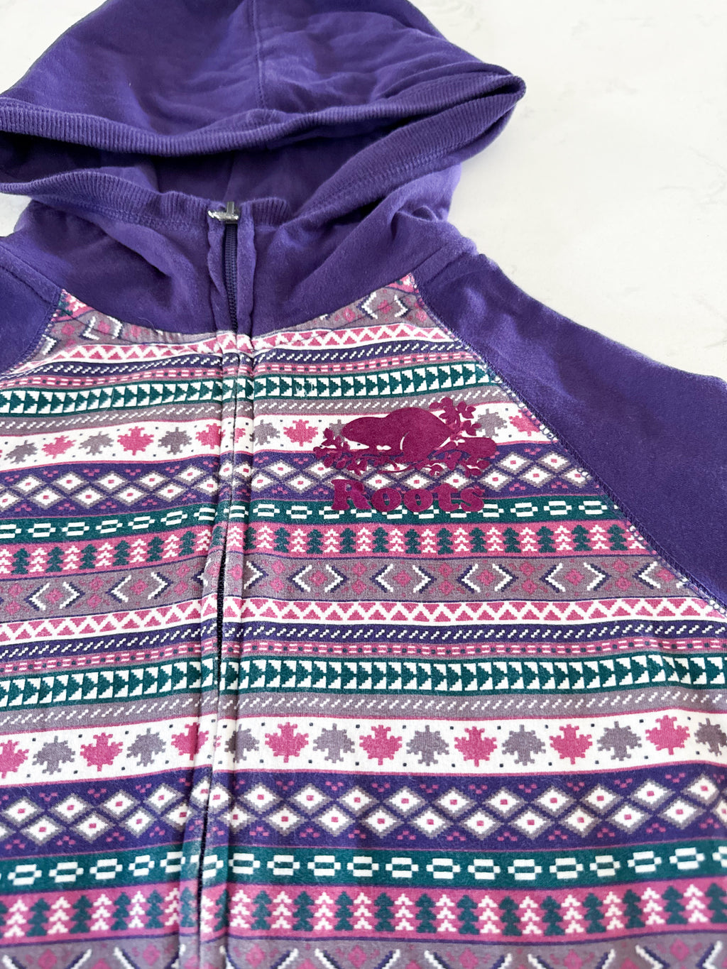 Roots- 11-12Y- GUC- purple patterned zip up with medium purple logo