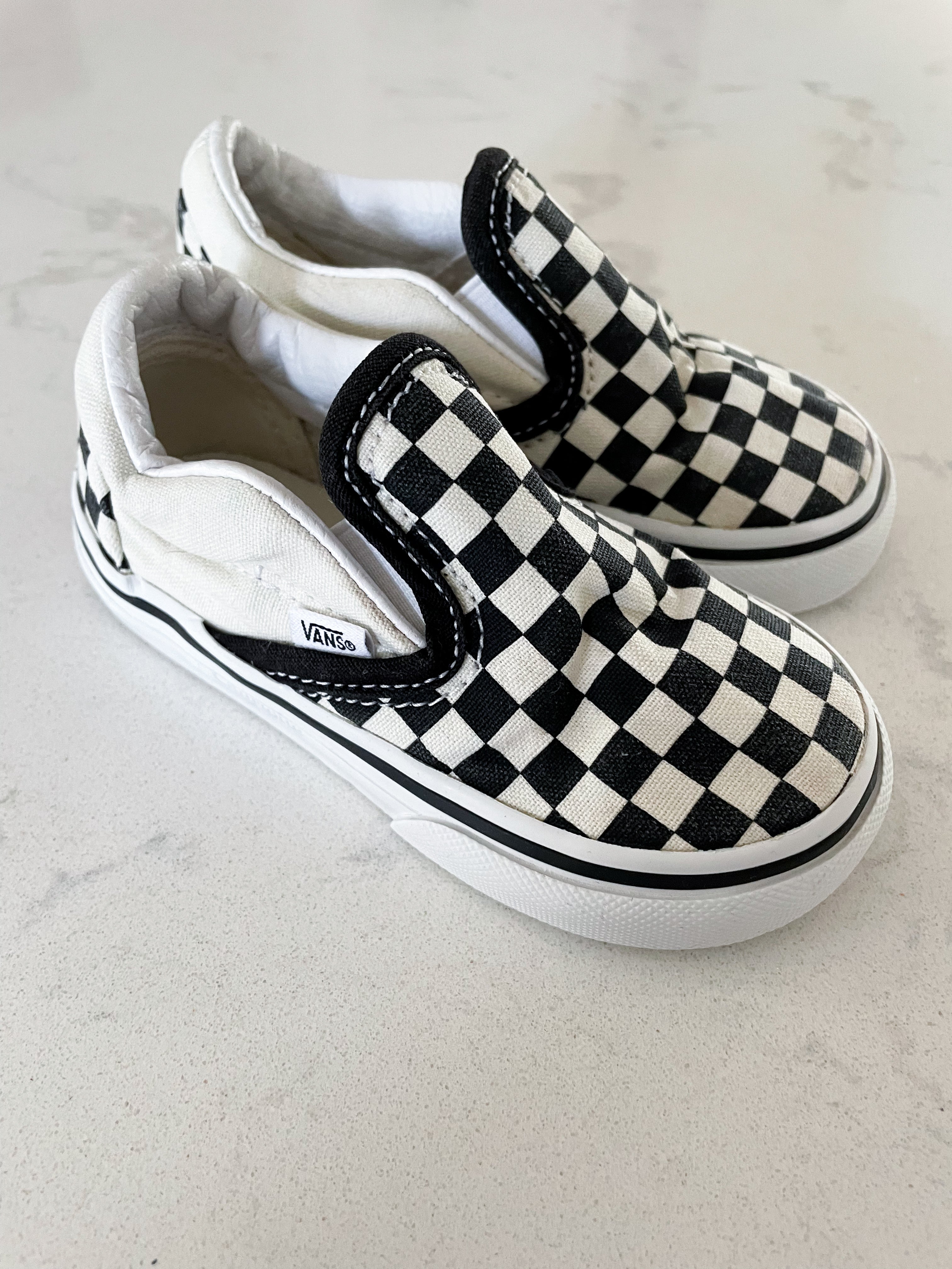 Vans- 6C- slip on black and white checkered shoes