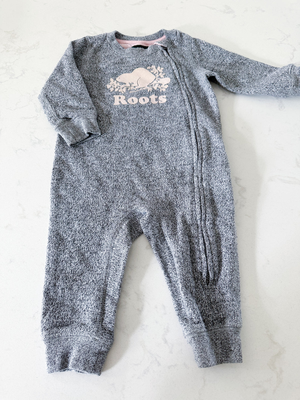 Roots- 6-12m- GUC- Grey speckled one piece sweat suit with pink logo