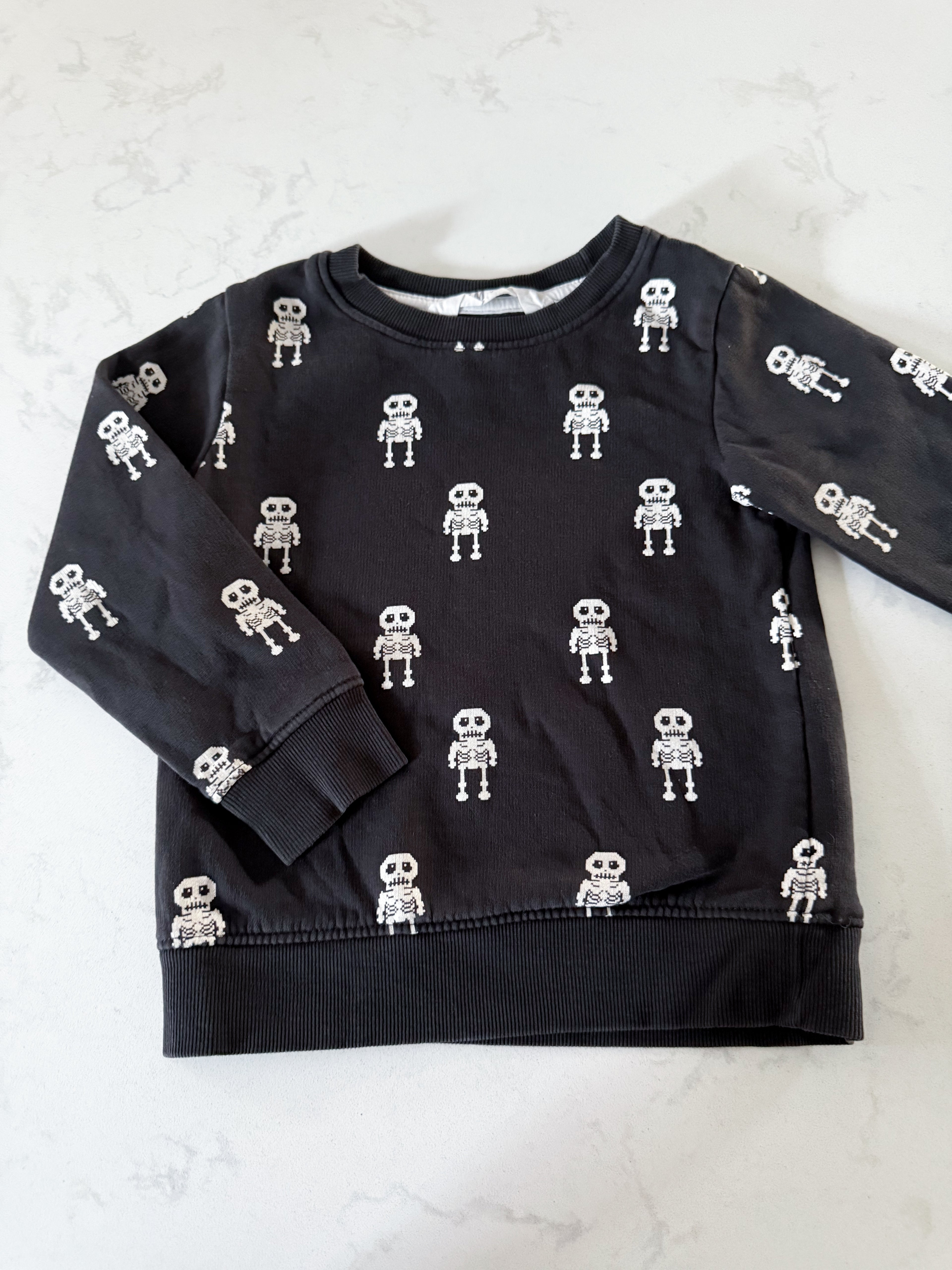H&M- 2-4Y- GUC- black crewneck skeleton pattern