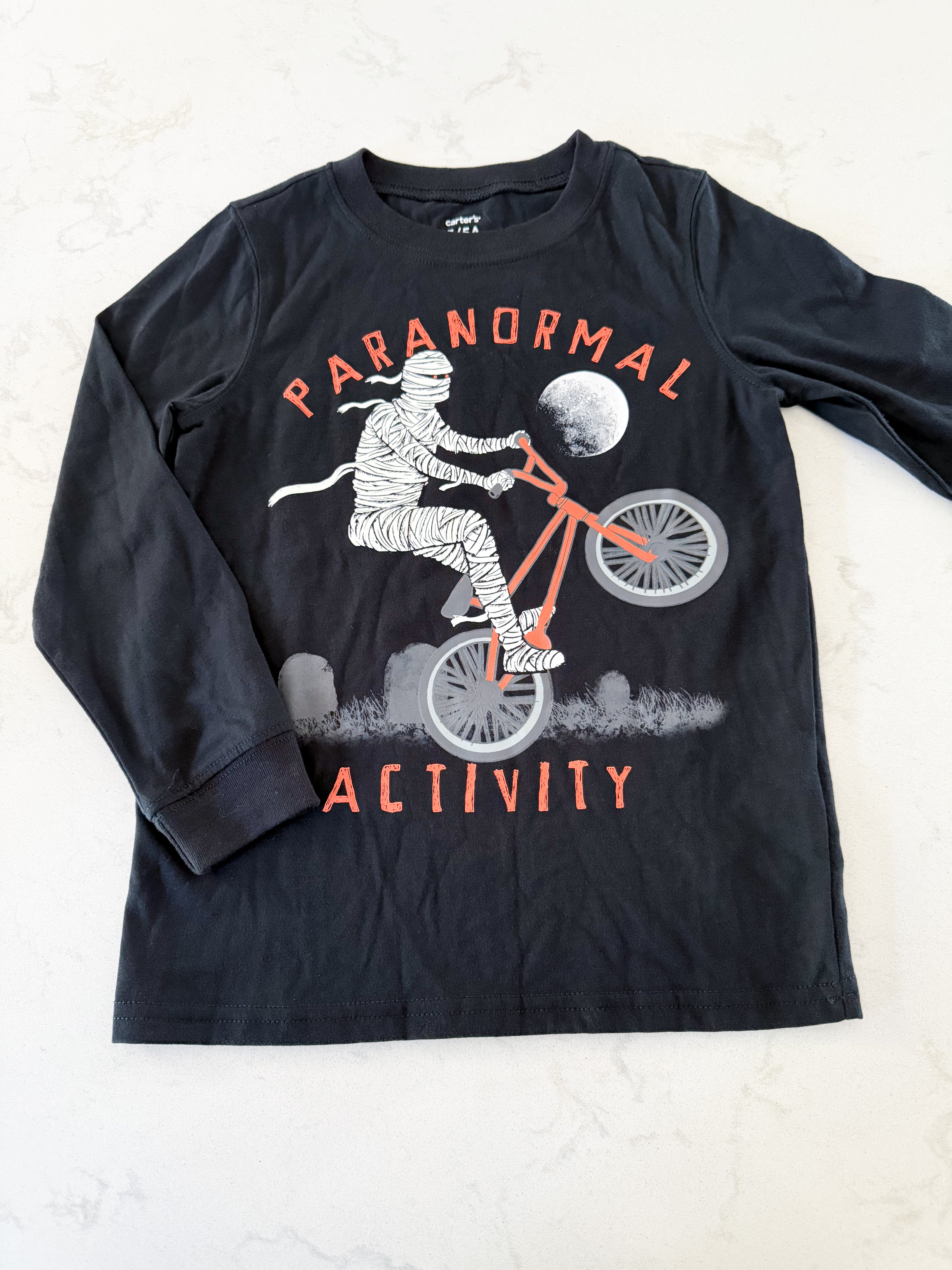 Carters- 5T- EUC- long sleeve black shirt with mummy riding bike
