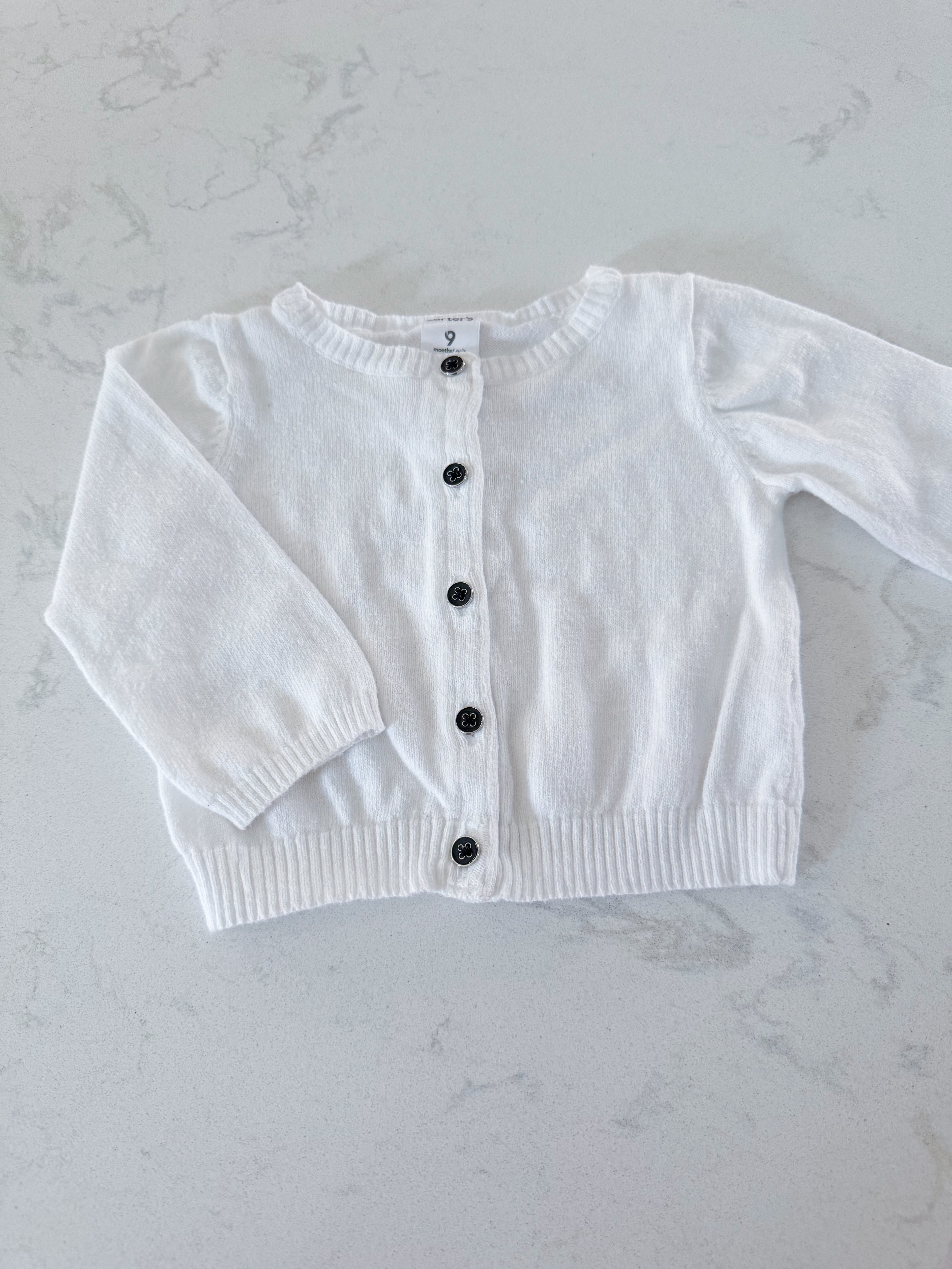 Carters- (fits 3-6m)- GUC- white knit cardigan with black buttons