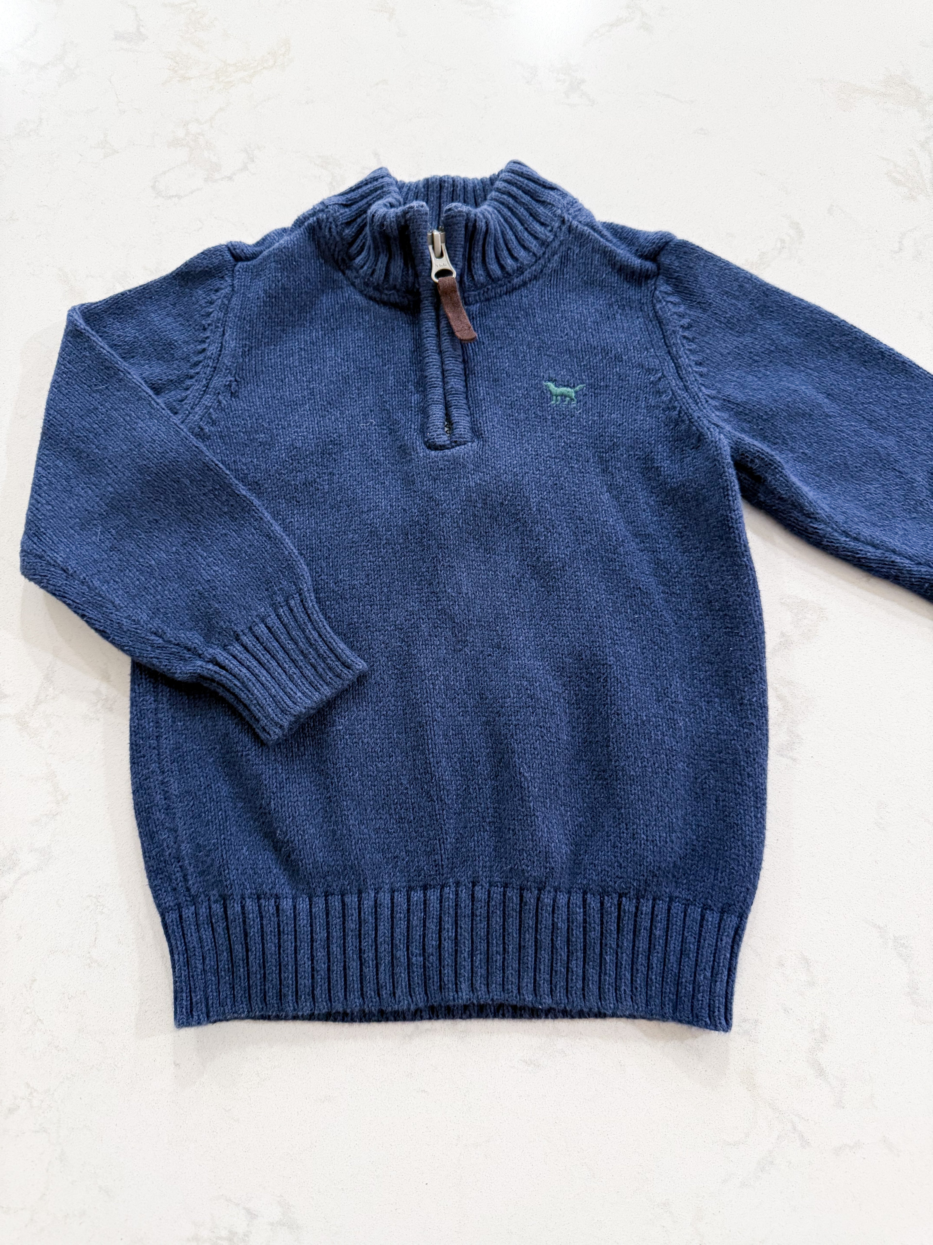 Carter’s-2T- GUC- navy quarter zip with green symbol