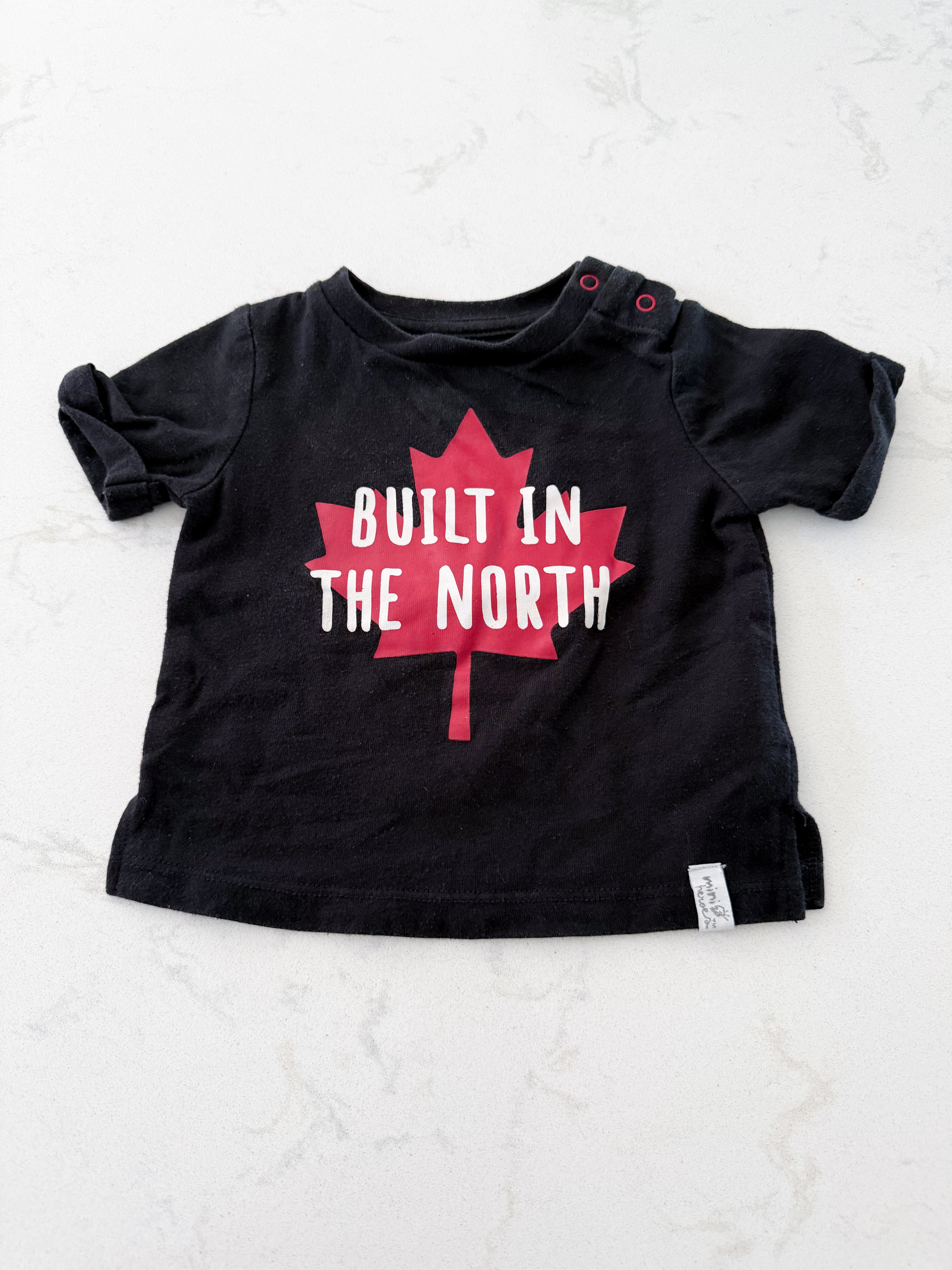 Mini Heroes- 3m- VGUC- black shirt with Canada leaf and “built in the north”