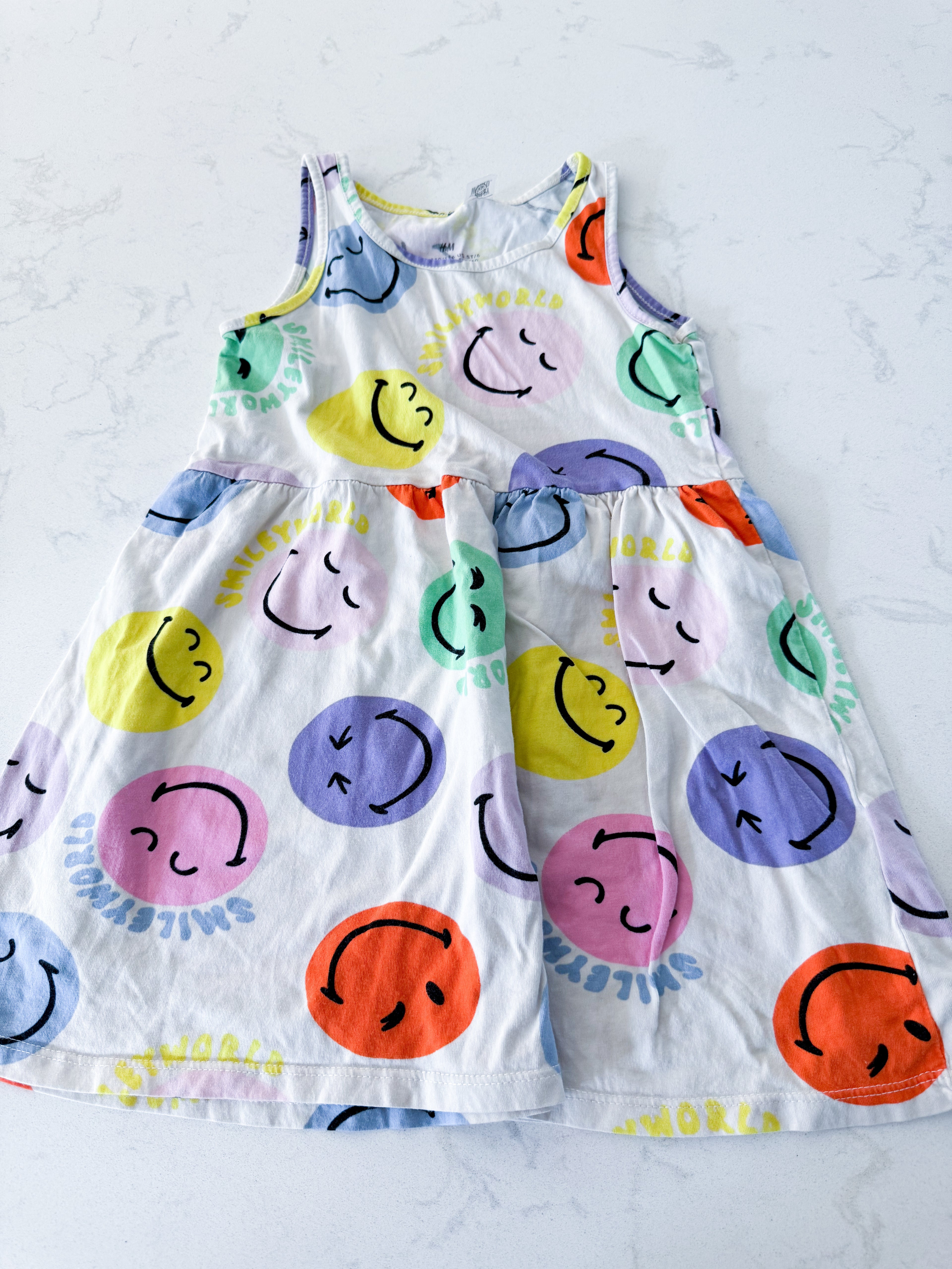 H&M- 6/7Y- VGUC- cream coloured dress with multicoloured smiley faces