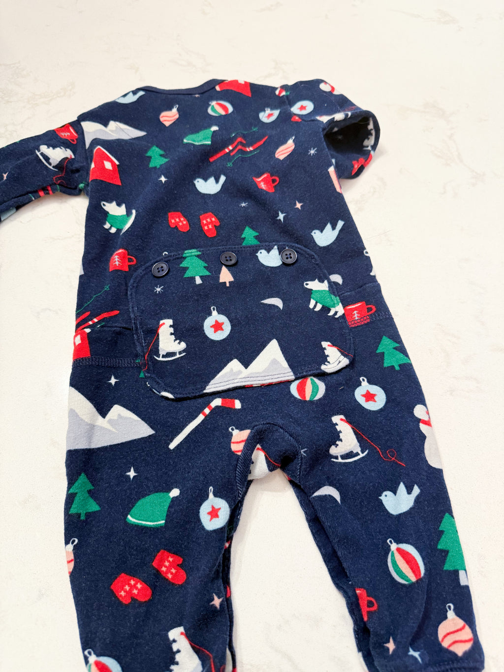Hatley- 3-6m- GUC- navy blue button up footless pajamas with patch on bum and winter Christmas pattern
