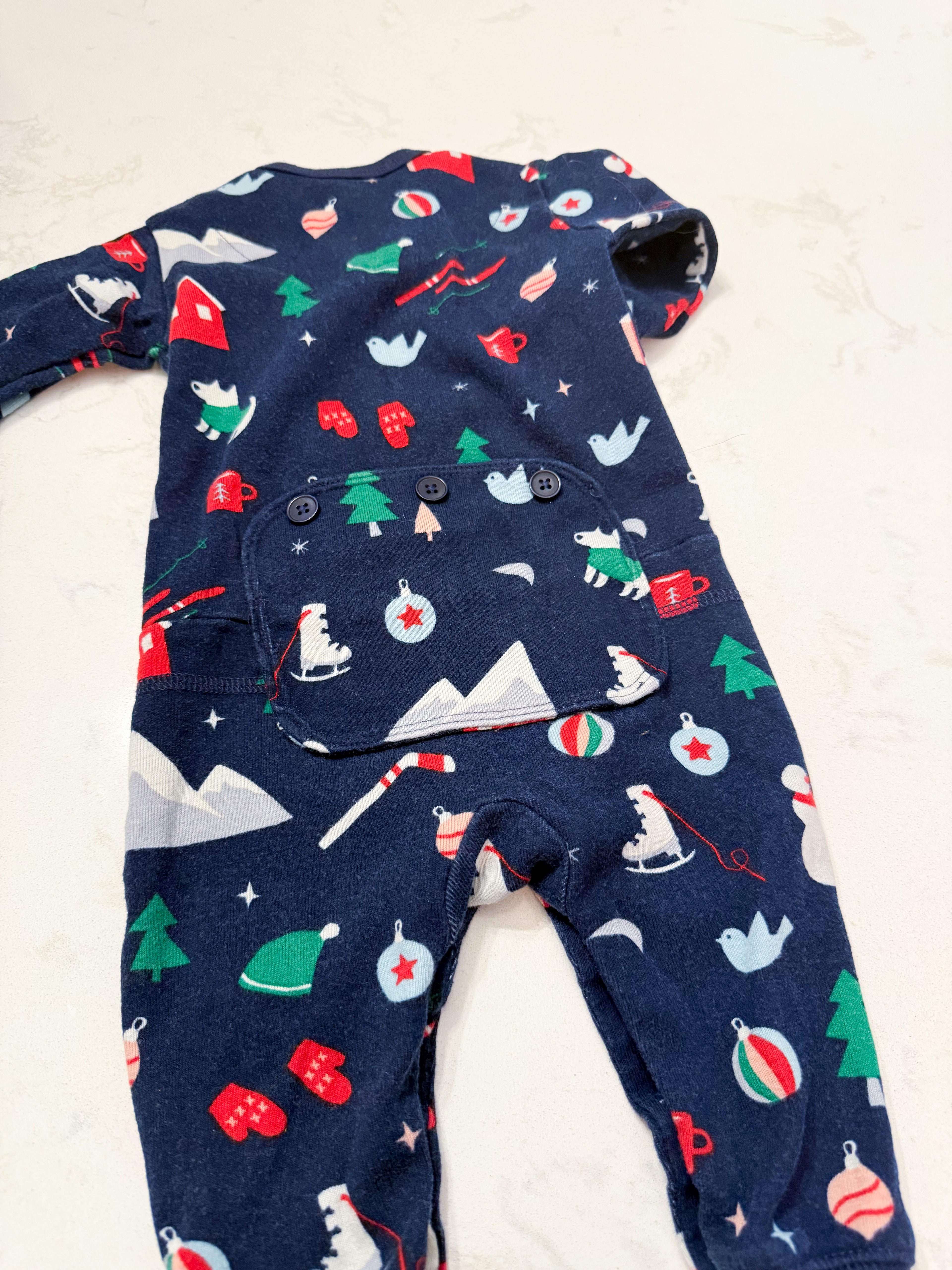 Hatley- 3-6m- GUC- navy blue button up footless pajamas with patch on bum and winter Christmas pattern