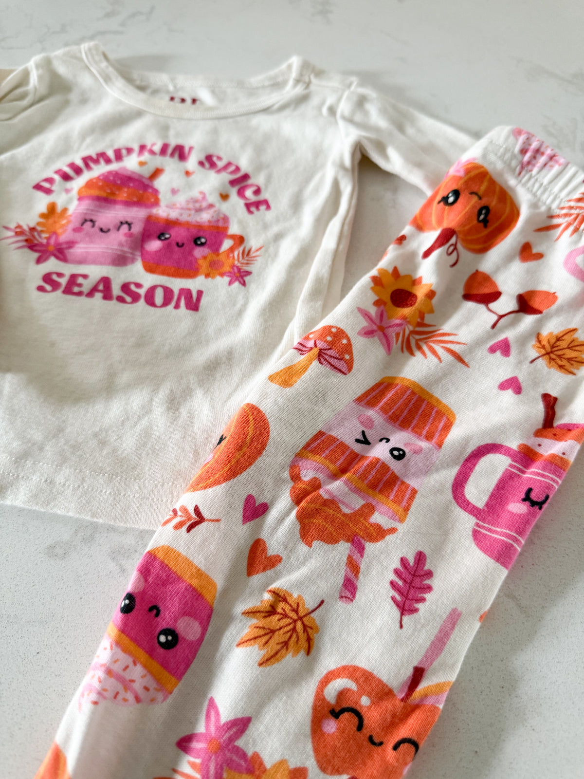 The Children’s Place- 9-12m- PLAY- long sleeve white jammies with pink and orange pumpkin spice pattern