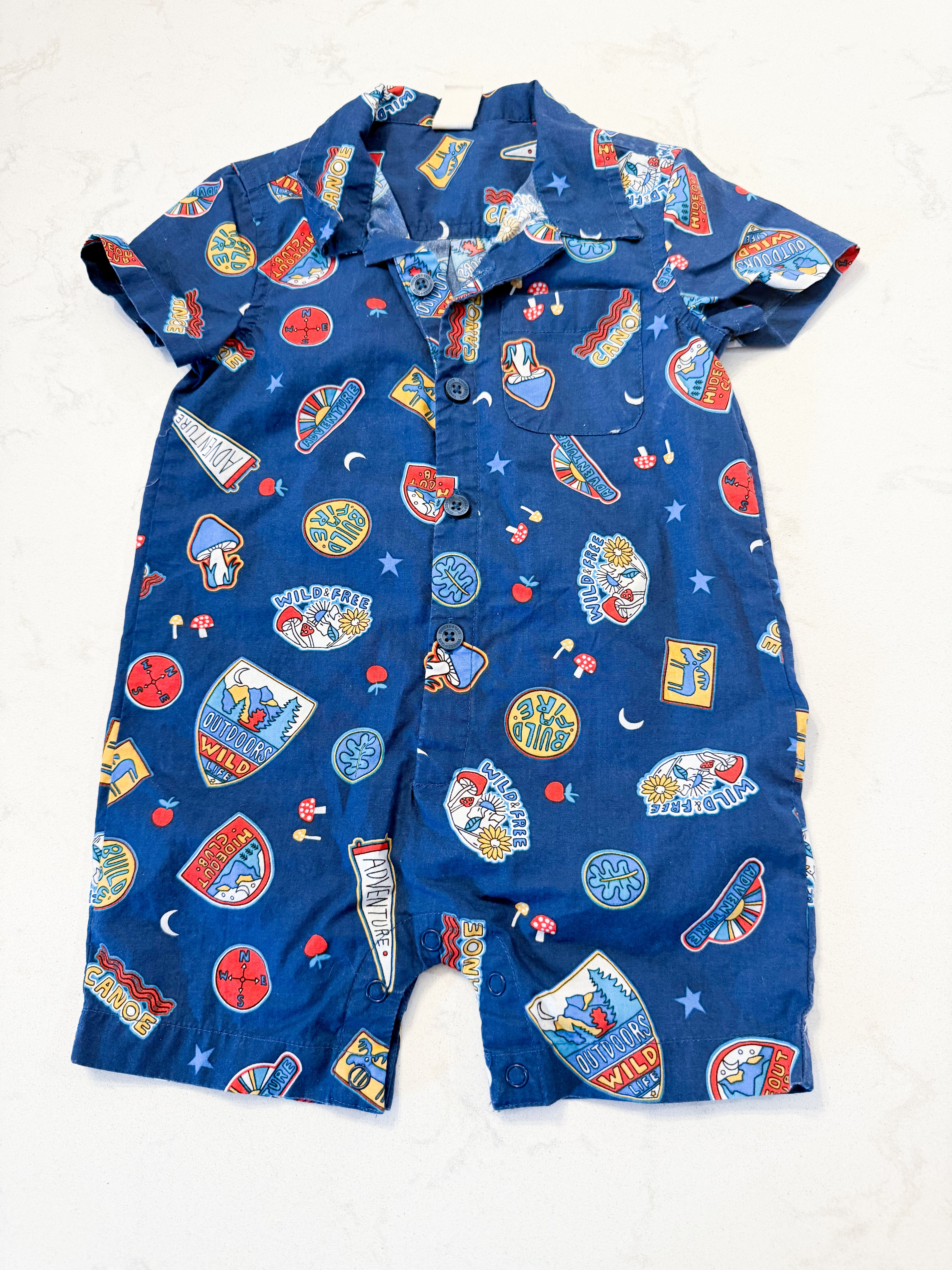Tucker + Tate- 12-18m- GUC- blue shorts romper with outdoor badges graphic