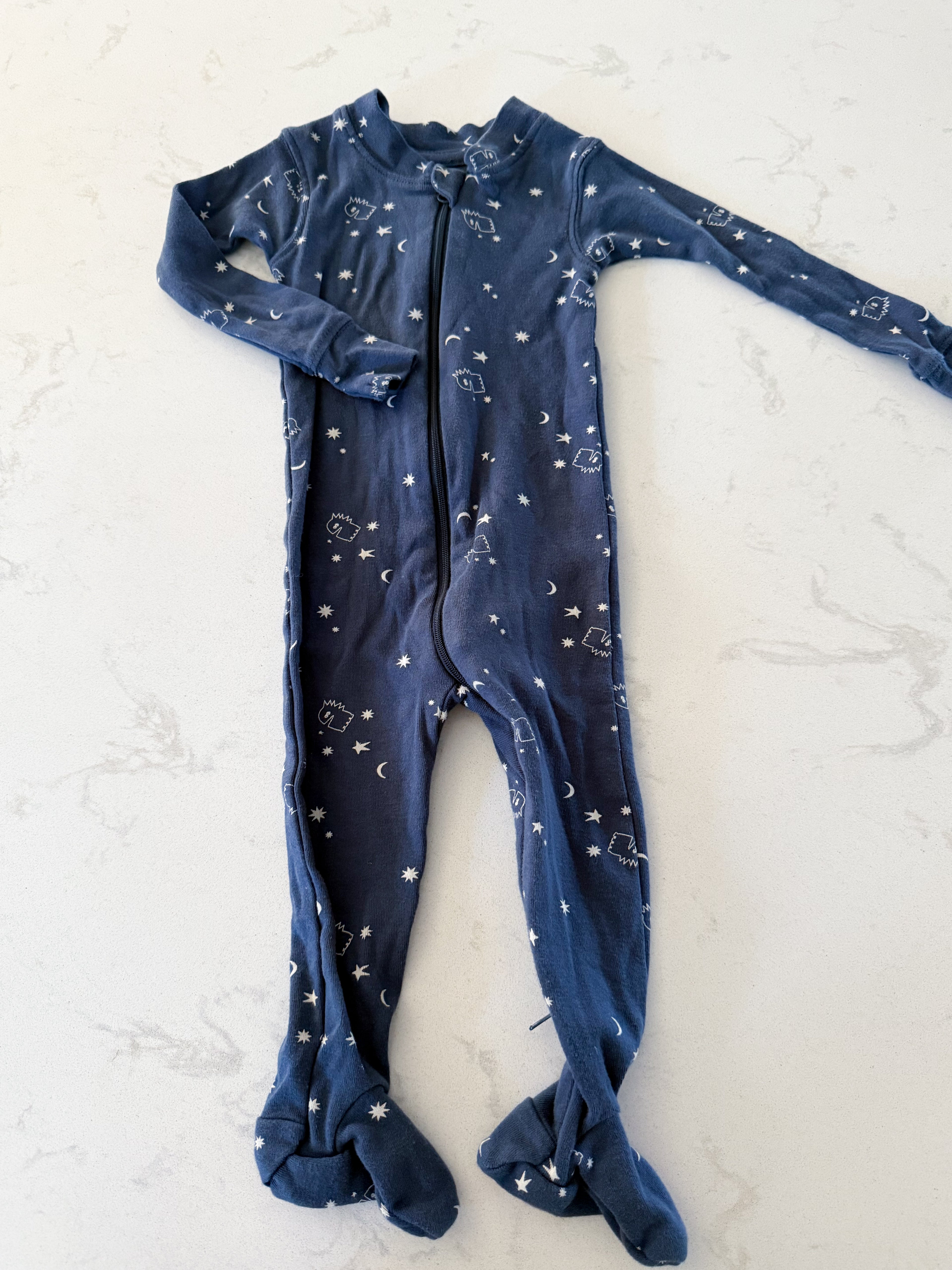 Rise Little Earthling- navy blue footie jammies with RLE character