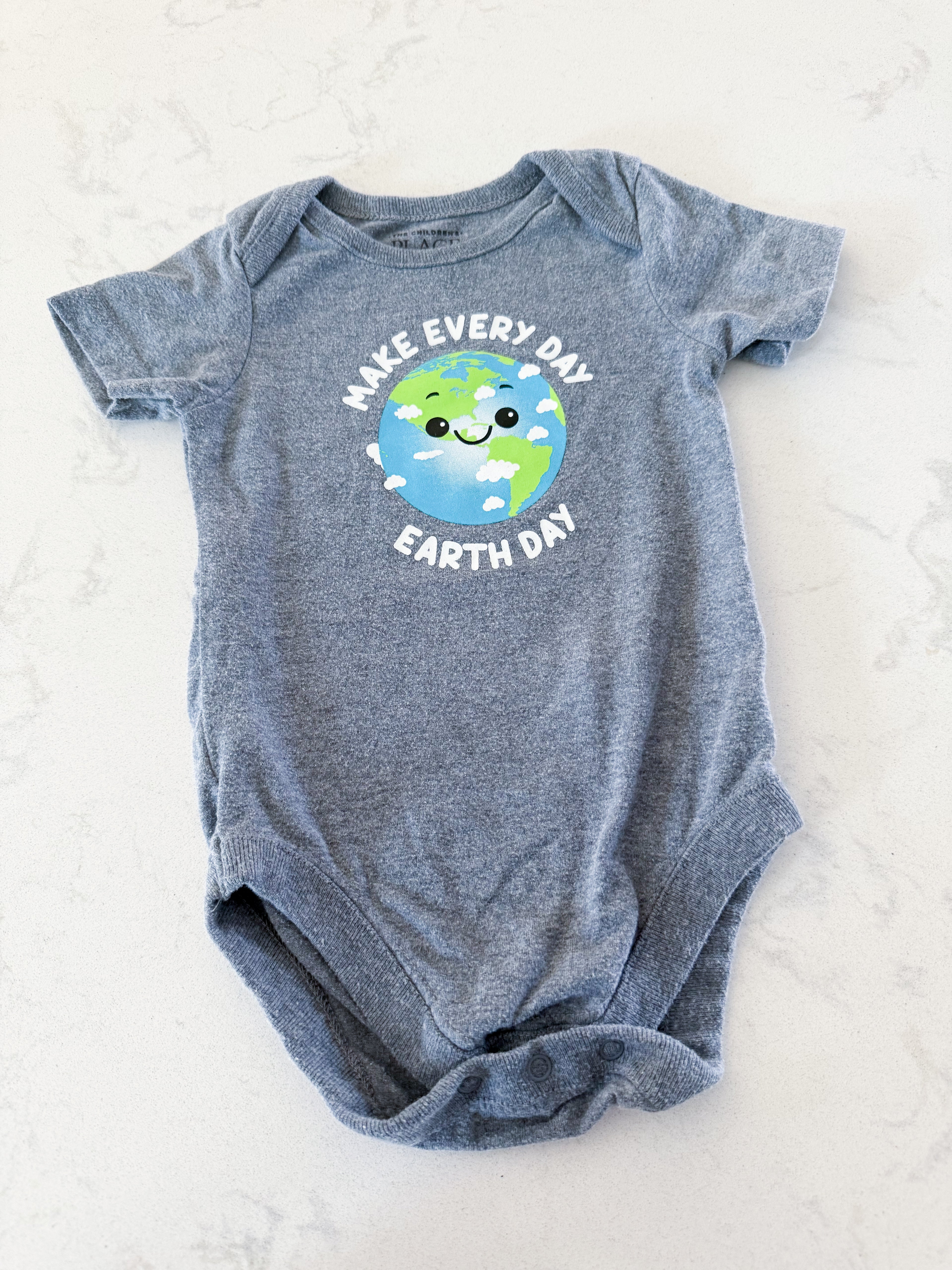 The Children’s Place- 3-6m- GUC- short sleeve bodysuit with earth on front