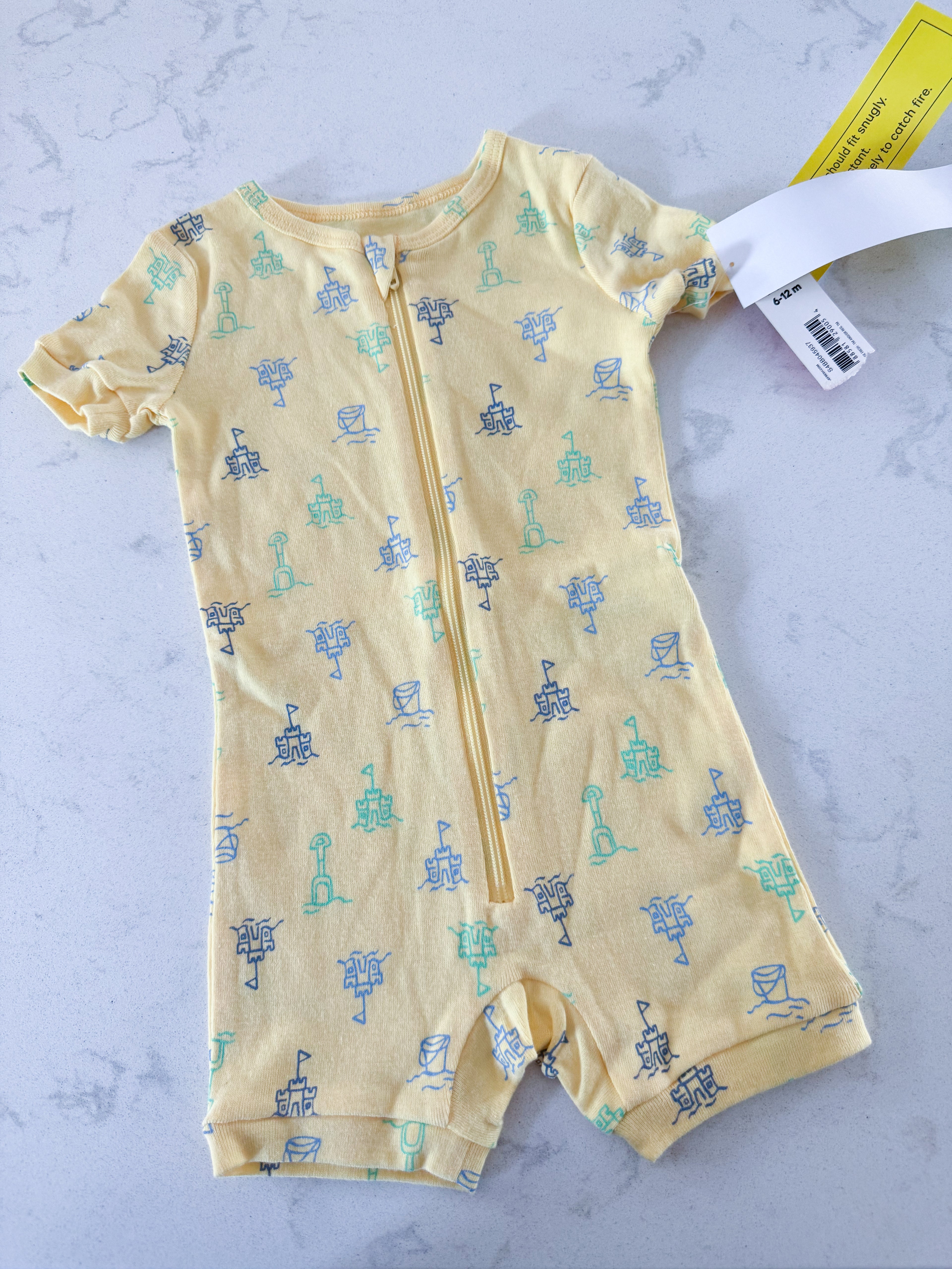 Joe Fresh- 6-12m- BNWT- yellow shortie pajamas/romper with sandcastles and sand toy graphics