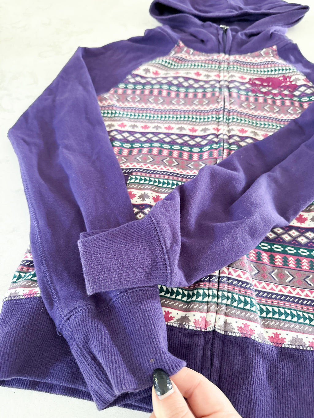 Roots- 11-12Y- GUC- purple patterned zip up with medium purple logo