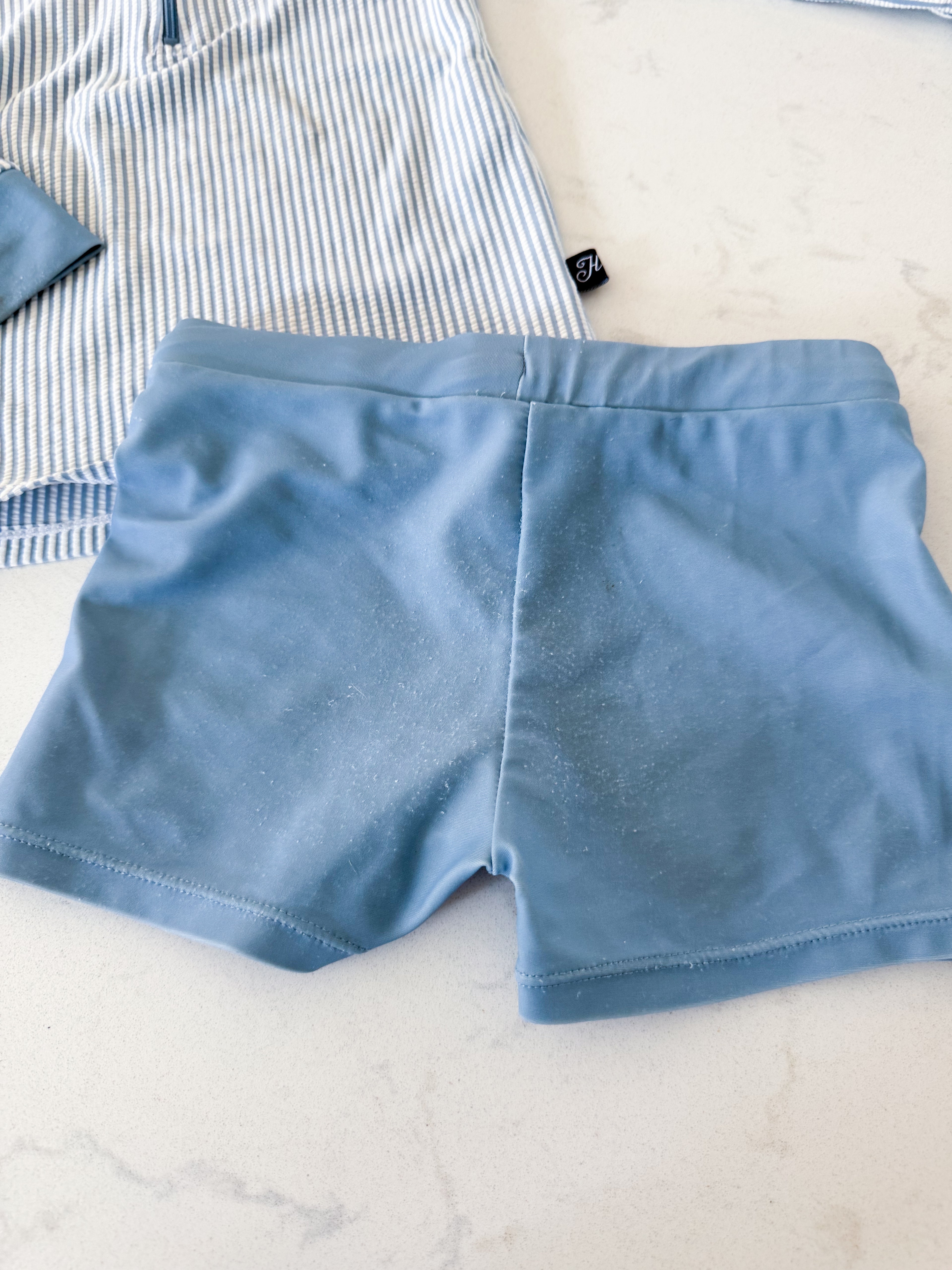 Honeysuckle Swim Company- 4/5Y- PLAY- dusty blue and white striped rashguard with matching blue shorts