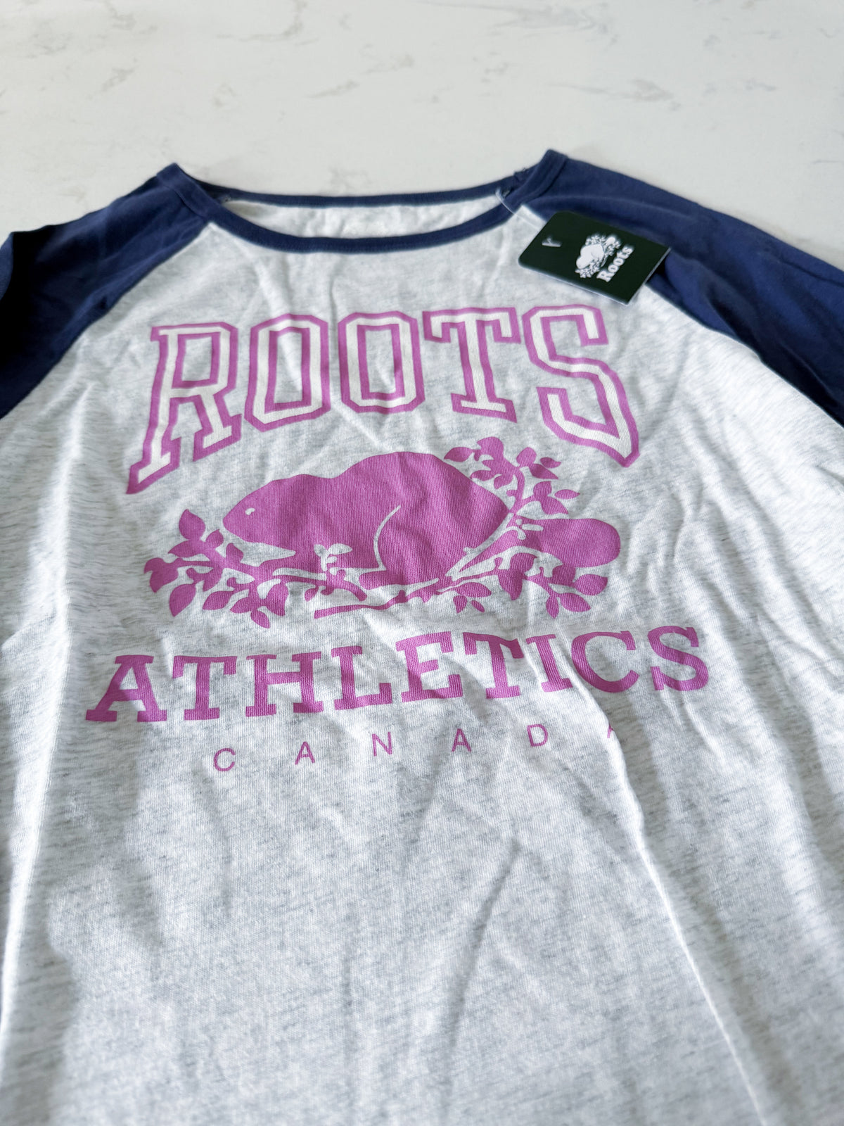 Roots- 9-10Y- BNWT- long sleeve shirt with blue sleeves and pink logo