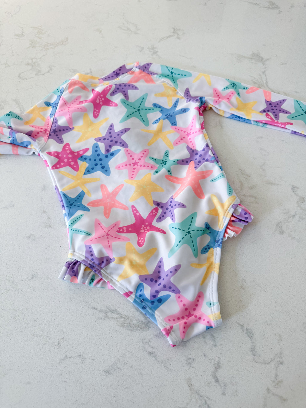 George- 2T- VGUC- white long sleeve bodysuit with colourful starfish