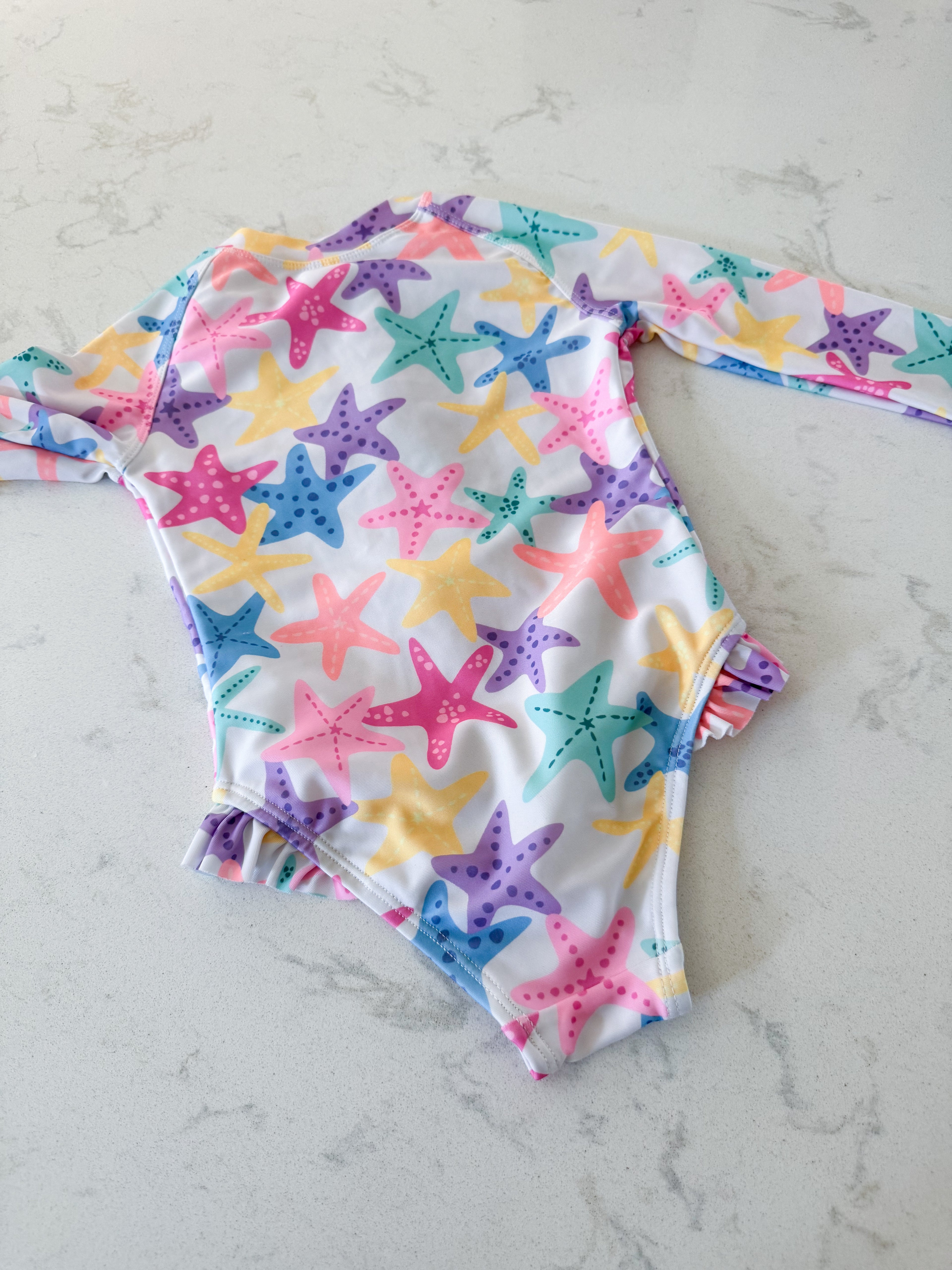 George- 2T- VGUC- white long sleeve bodysuit with colourful starfish
