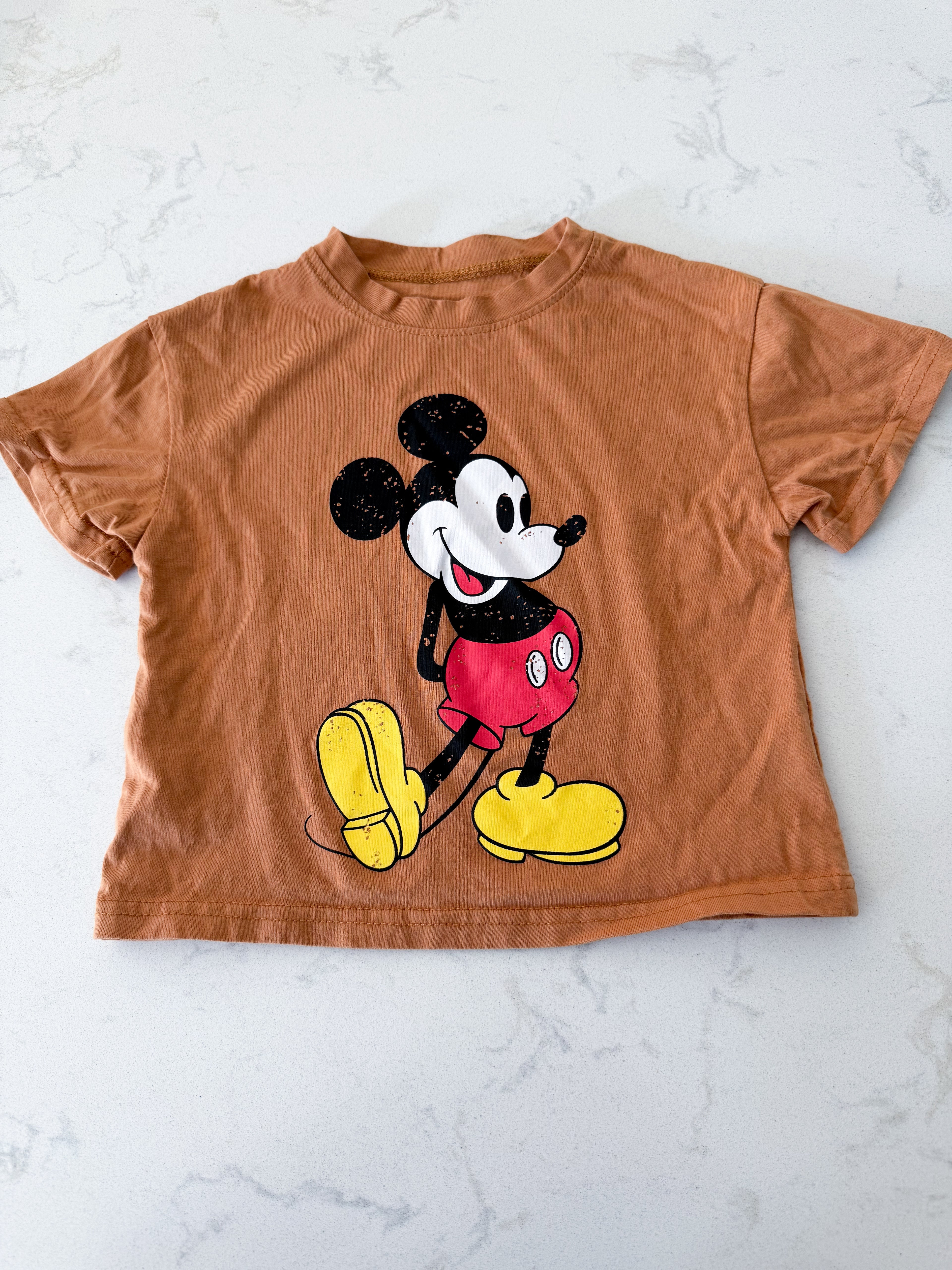 No brand- fits 12-18m- VGUC- orange ish brown t shirt with Mickey Mouse graphic